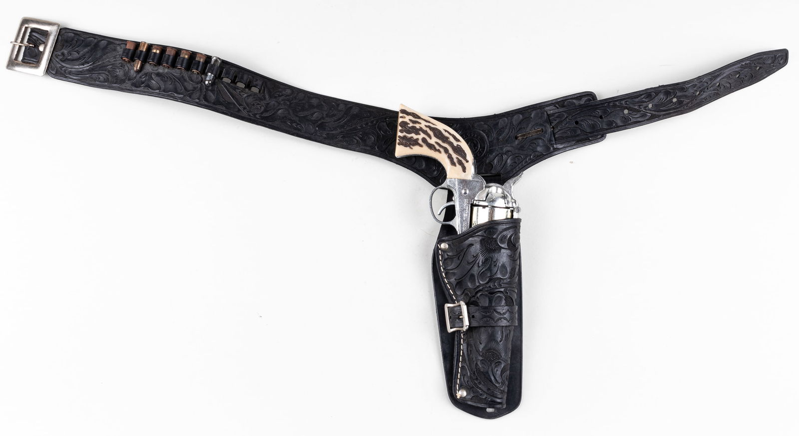 MATTEL SHOOTING SHELL 45 REVOLVER CAP GUN: 'Shootin' Shell 45' die-cast revolver cap gun made by Mattel Inc. 11.25 inches long, minor wear to the revolver. With a Mattel Fanner plastic holster, 33 inches long.