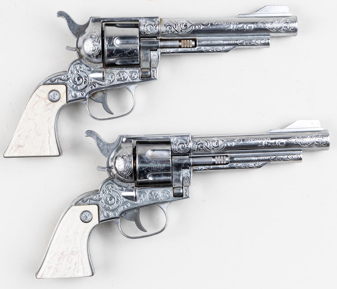 2 NICHOLS STALLION 41-40 CAP GUNS: Two Nichols 'Stallion 41-40' die-cast cap guns, 10 inches long each. Fully operational. Includes six toy bullets.