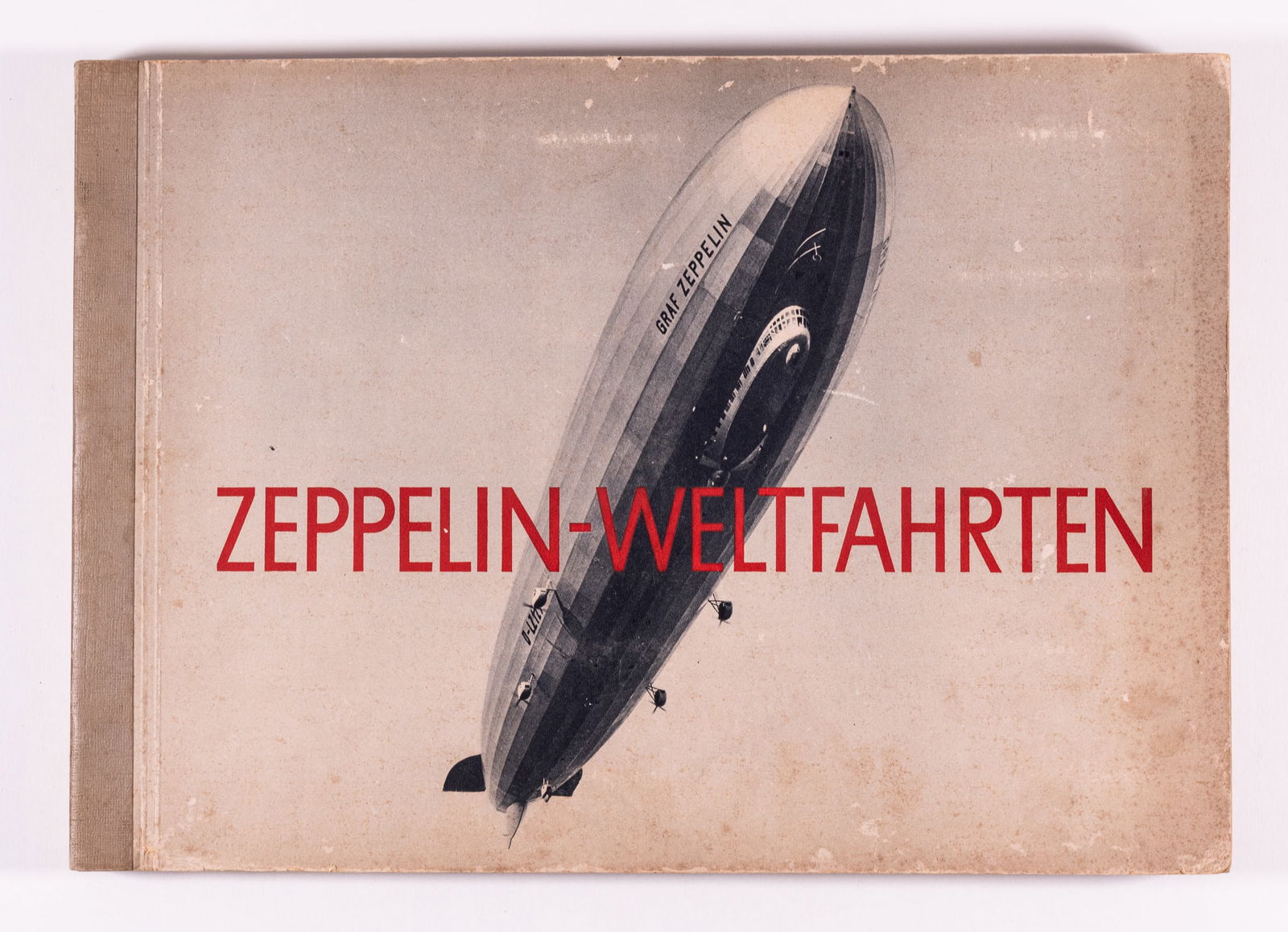 GRAF ZEPPELIN WELTFAHRTEN ALBUM: Complete volume of the German 'Zeppelin-Weltfahrten' (Zeppelin World Travels) cigarette card album. Album is complete with 265 photographs of Zeppelins, detailed photographs of the technical aspects o