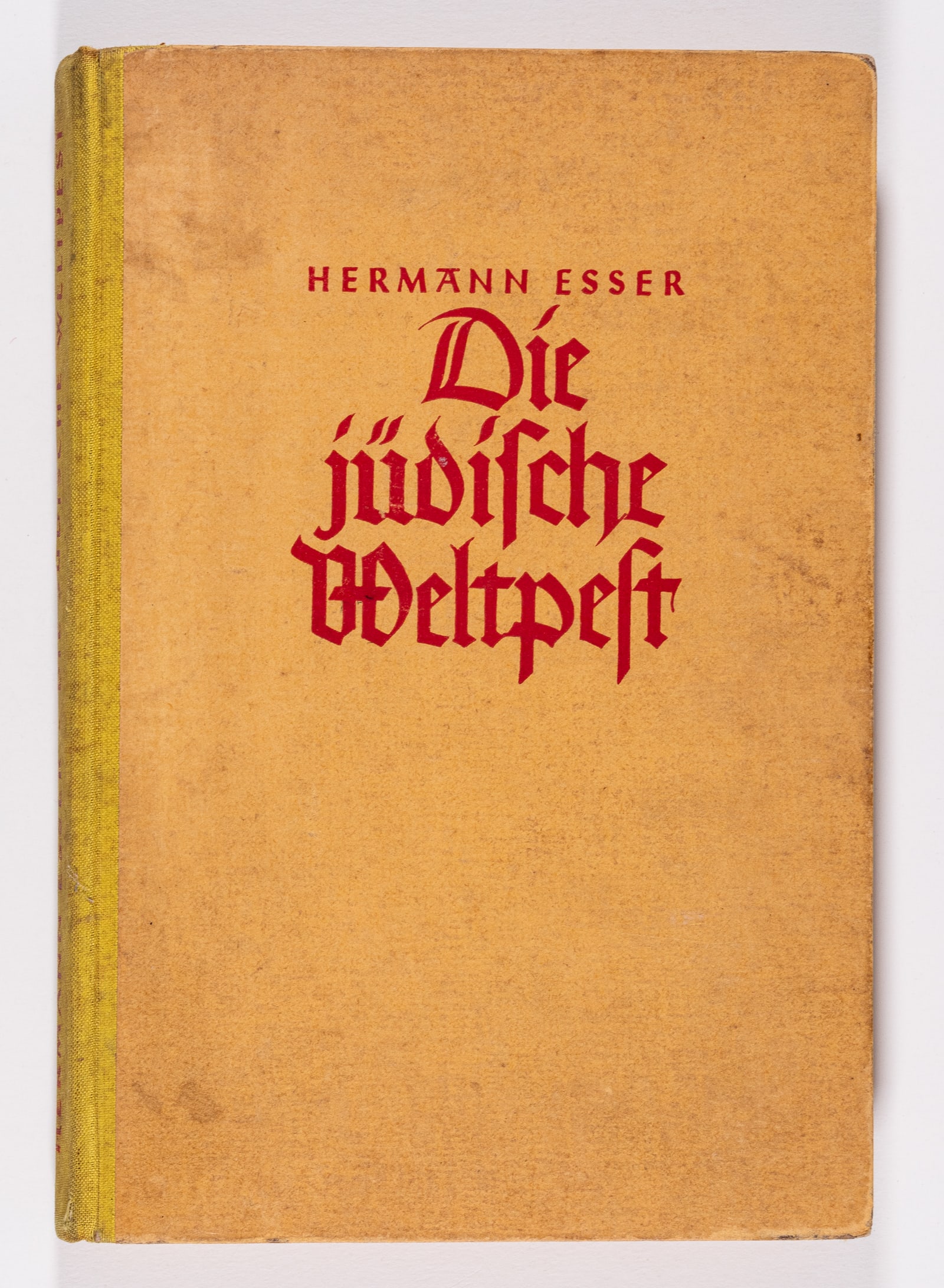 THE JEWISH WORLD PLAGUE WWII BOOK: WWII German book titled 'Die Judische Weltpest' [The Jewish World Plague] by Hermann Effer, 1943. Yellow hardcover book, 9 x 6 inches, 244 pages. The content included shows a lack of sympathy towards 