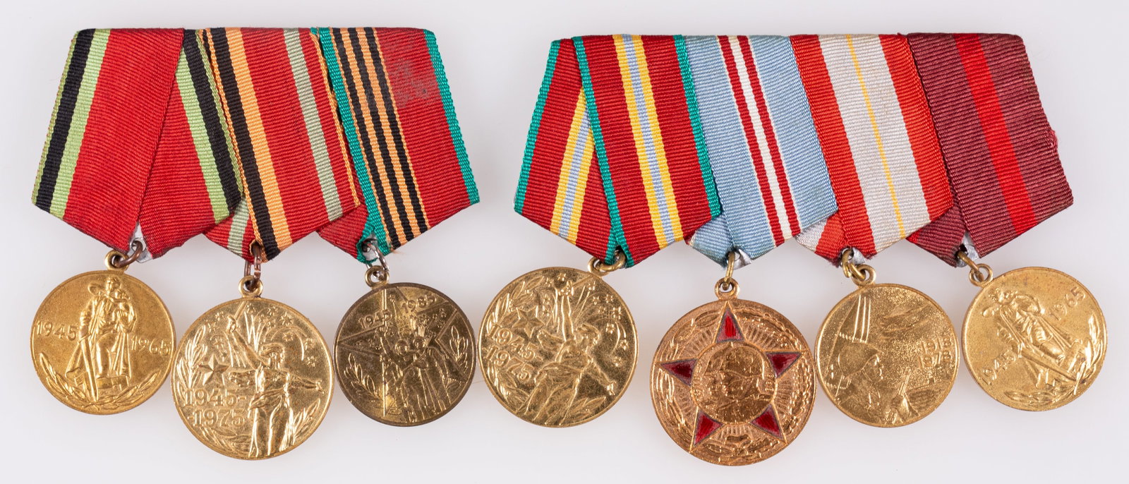 2 SOVIET MEDAL BARS W/ 7 MEDALS: Two Soviet medal bars with seven medals, one bar with the 20, 30, and 40 years of Victory in the Great Patriotic War medals attached, the other bar with the 20 and 30 years of Victory in the Great Pat