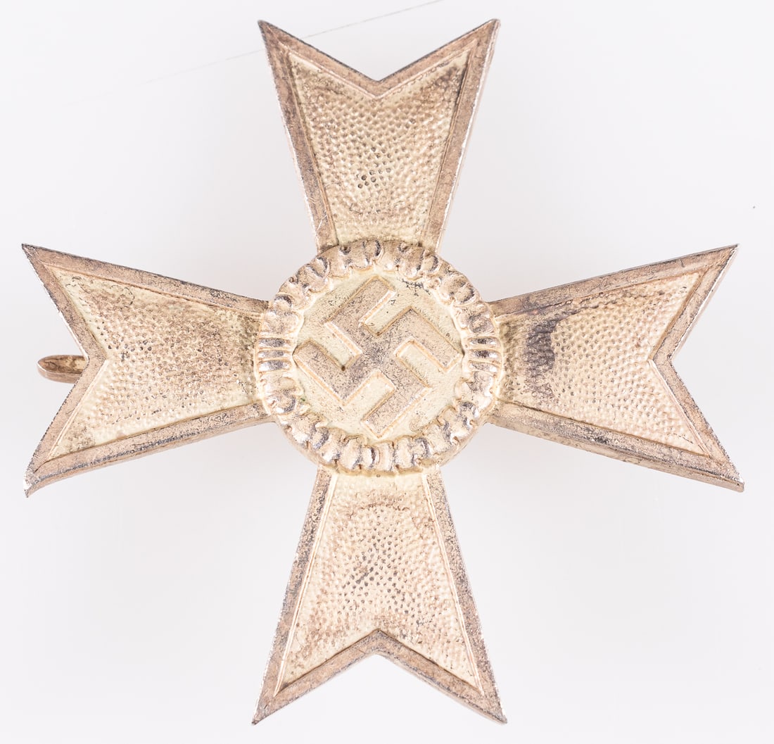 WAR MERIT CROSS 1ST CLASS W/O SWORDS DESCHLER: WWII German War Merit Cross 1st class w/o swords, makers mark on the pin '1' for Deschler and Sohn, Munchen, C clasp pinback, 1 7/8 x 1 7/8 inches.