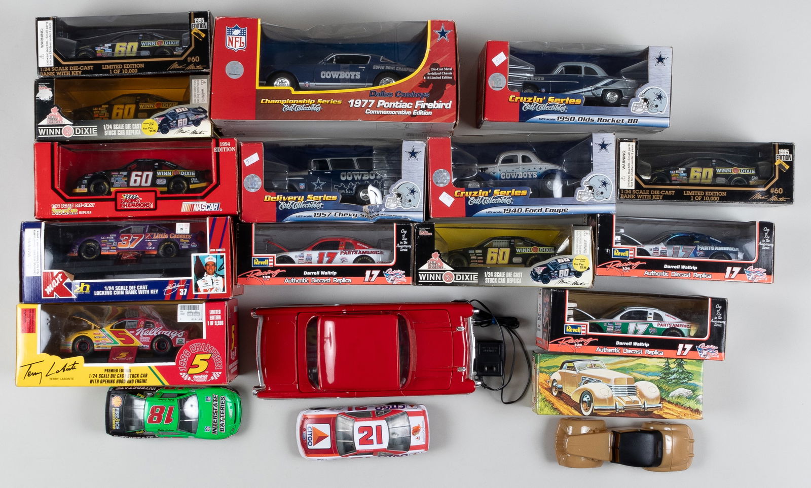 18 DIECAST NASCAR MODEL CARS: 18 diecast Nascar model cars, featuring: four ERTL diecast toy cars, all endorsed by the Cowboys football team, featuring: 1950 Olds Rocket 88; 1940 Ford Coupe; 1957 Chevy Suburban; With 1977 Pontiac