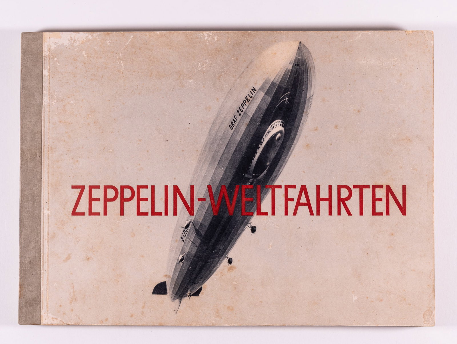 GRAF ZEPPELIN WELTFAHRTEN ALBUM: Complete volume of the German 'Zeppelin-Weltfahrten' (Zeppelin World Travels) cigarette card album. Album is complete with 265 photographs of Zeppelins, detailed photographs of the technical aspects o