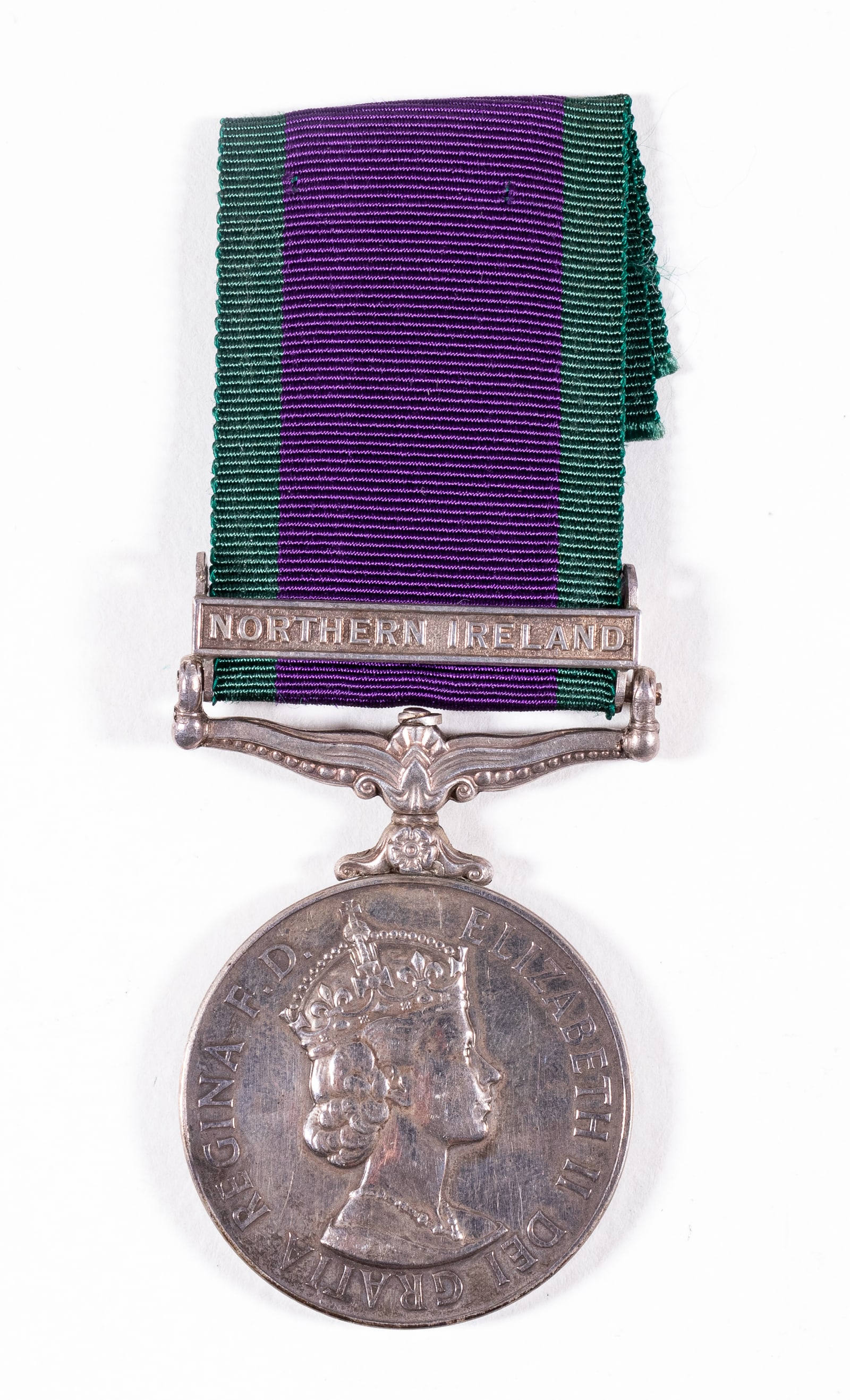 NAMED BRITISH GENERAL SERVICE MEDAL NORTHERN IRELAND: British General Service Medal (Elizabeth II)with the Northern Ireland campaign bar, awarded to and marked on the rim '24266100 PTE. P. SEWELL GREEN HOWARDS.'