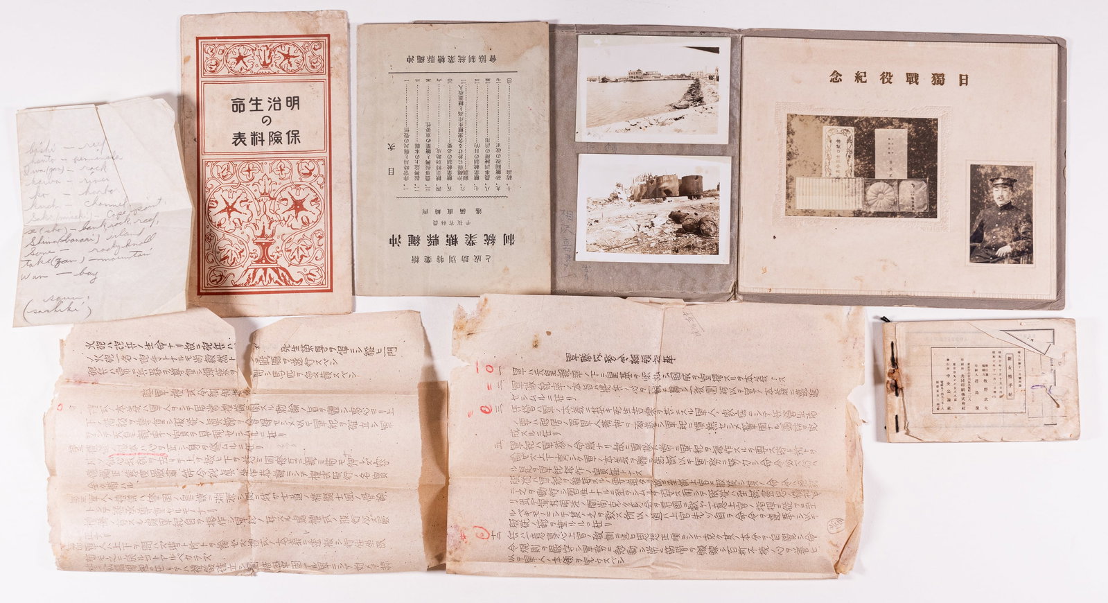JAPANESE KAMIKAZE PILOT GROUP: WWII Japanese ephemera grouping, with a Kamikaze Pilots ceremonial photo showing the pilot in dress uniform and the gift basket he received before flying, also includes Japanese letters, two b/w photo