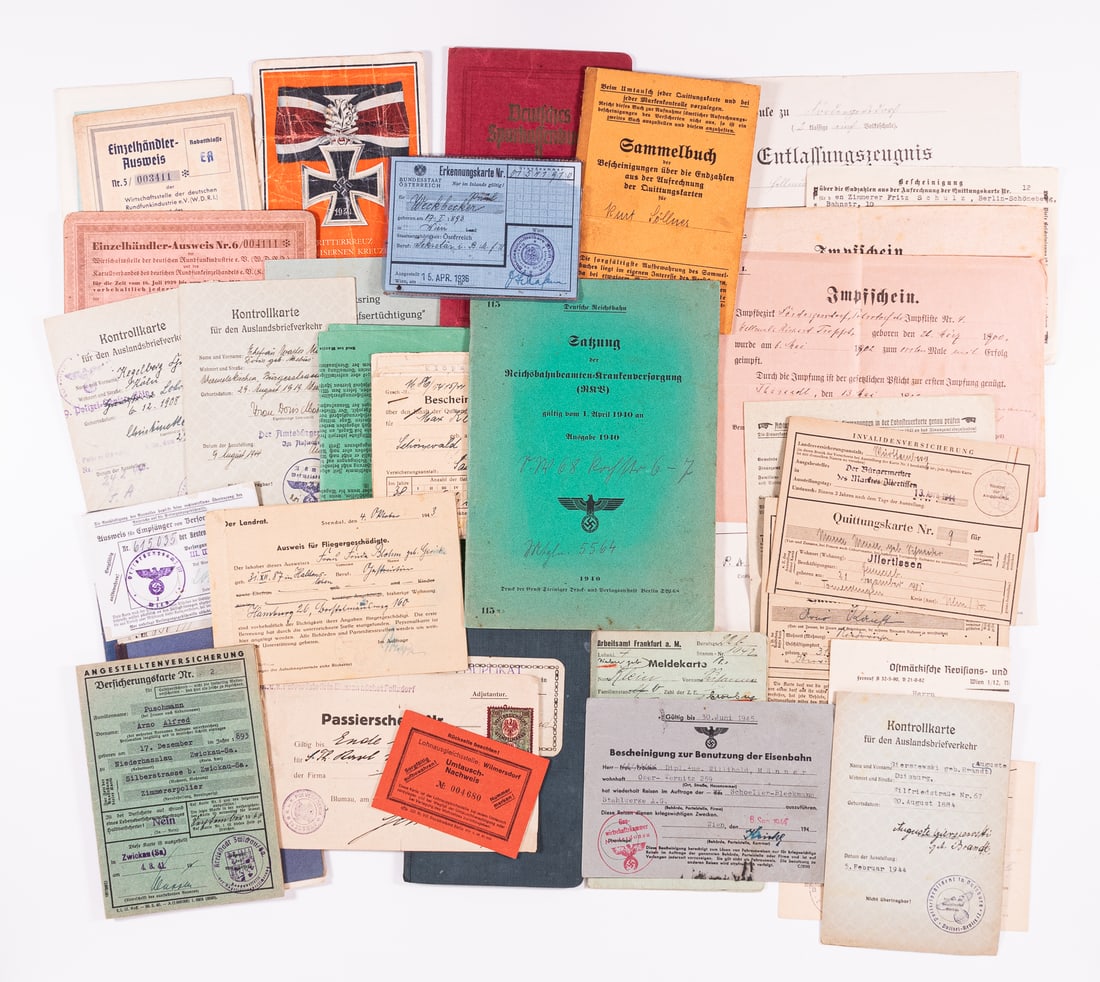 WWII GERMAN EPHEMERA GROUPING (25+): WWII German ephemera group with over 25 documents, including IDs, control cards, insurance sheets/booklets, healthcare booklets, employment cards, postcards, etc. Usual wear.