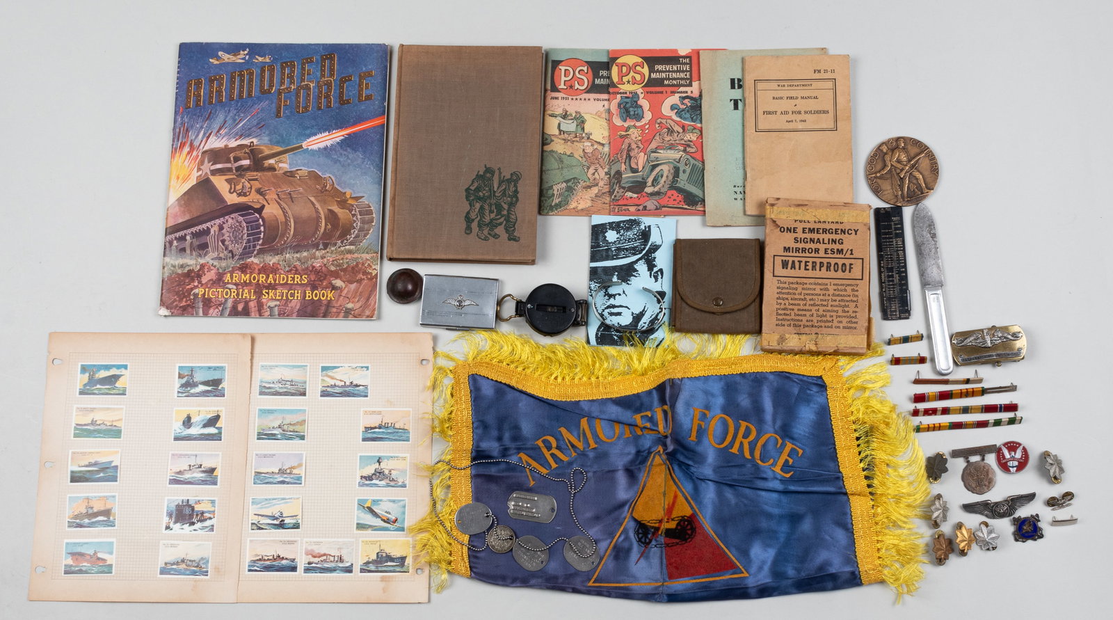 WWI / WWII SOLDIERS' GROUPING: Group of WWI and WWII soldiers ephemera including four US Navy dog tags for Alexander Baumer, soldier number 60-76-46; Army dog tag for soldier David Pfund, soldier number RA12573831; WWI trench cante