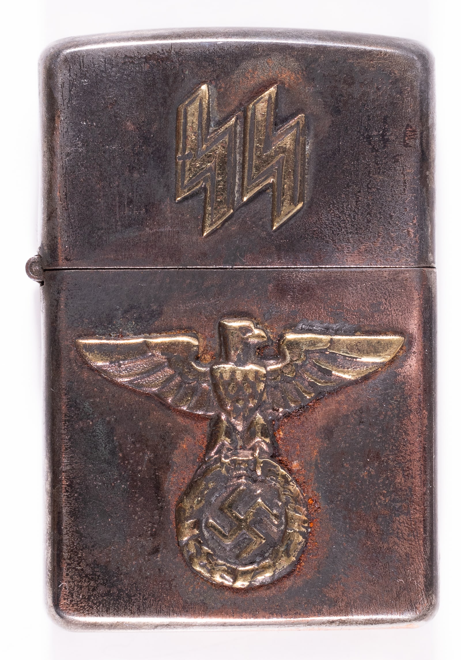 SS CIGARETTE LIGHTER: Zippo-style lighter decorated with an eagle clutching a swastika inside an oak leaf wreath and 'SS' Runes. As-is.