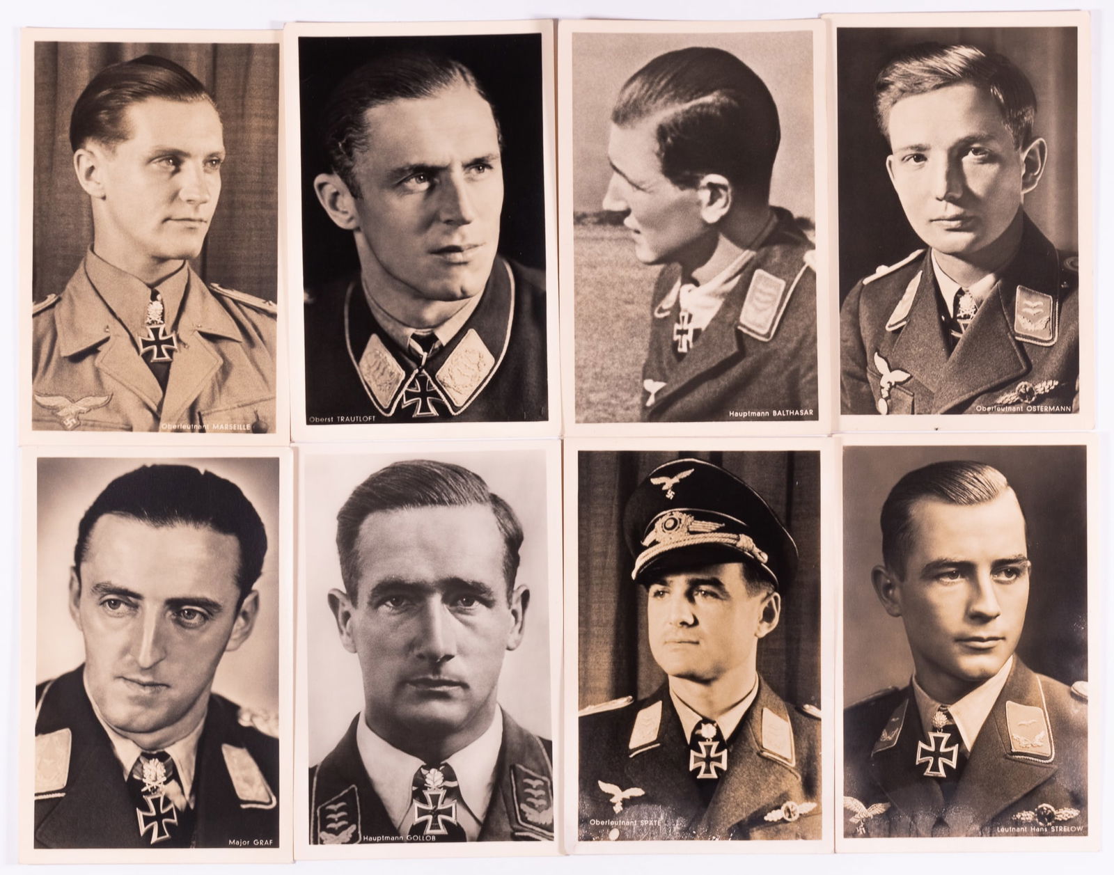 8 HOFFMAN POSTCARDS OF LUFTWAFFE ACES: Lot of eight Heinrich Hoffman postcards of WWII German Luftwaffe aces, including Oberst Trautloft, Major Graf, Oberleutnant Spate, Oberleutnant Ostermann, Hauptmann Balthasar, Leutnant Hans Strelow, H