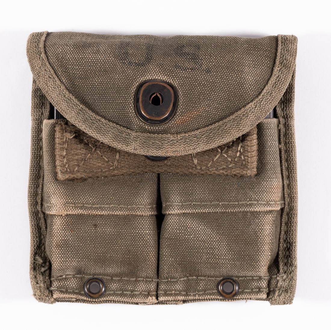 WWII M1 CARBINE MAGAZINE POUCH W/ 2 MAGS: WWII M1 Carbine rifle magazine pouch with two 15-round M1 Carbine rifle magazines, on the front of the pouch is stamped 'U.S.,' on the inside is stamping that has faded over time and is illegible. Ver
