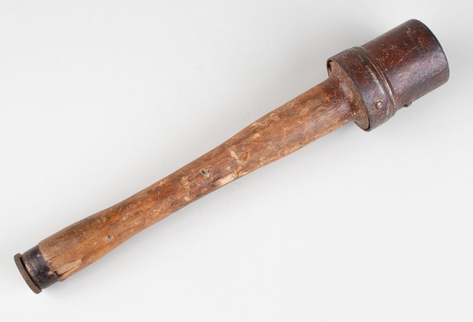 WWII GERMAN PRACTICE M24 STICK GRENADE: WWII German practice M24 stick grenade, or 'Stielhandgranate.' Made of a solid metal head, wooden handle, and bottom twisting practice fuse. Stamped on the handle is a manufacturing stamp for Meteor, 