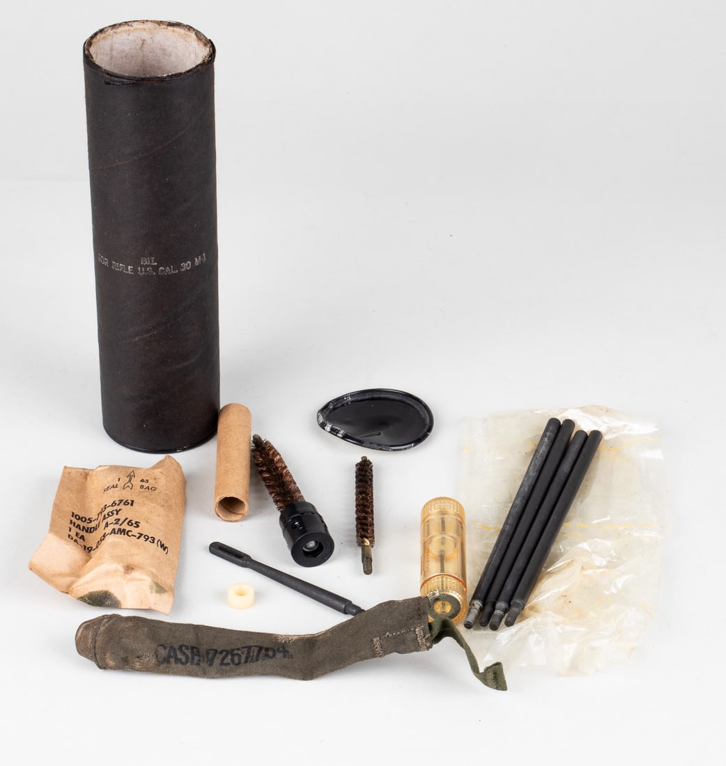 KOREAN WAR ERA M1 GARAND CLEANING KIT: Korean war era M1 Garand cleaning kit, with the original tube that reads 'Bil - For Rifle U.S. Cal. 30 M-1,' cleaning kit designed to fit into the buttstock of the M1 Garand. 7 3/8 inches long.