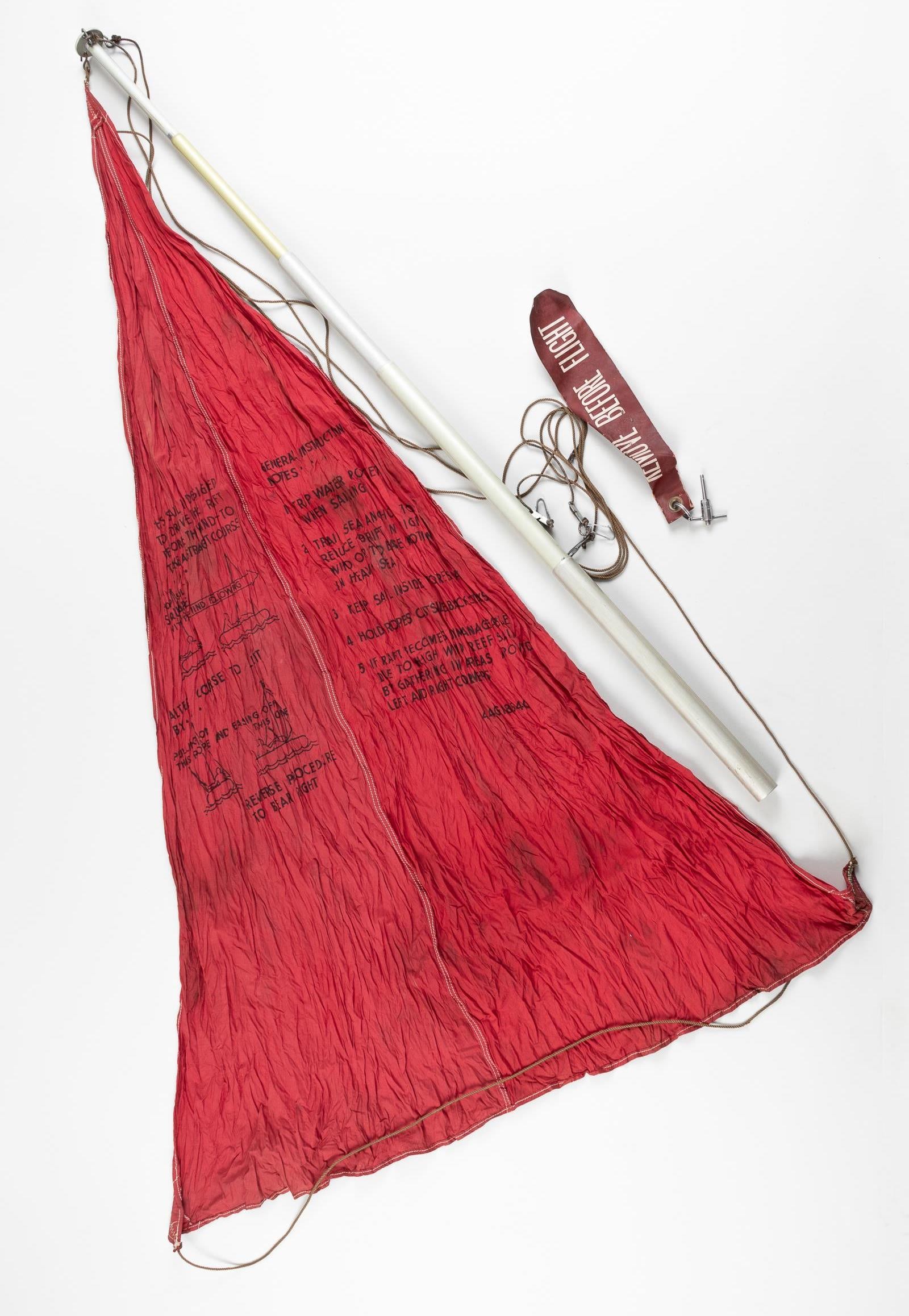 WWII USAAF C-2 LIFE RAFT MAST AND SAIL: WWII USAAF type C-2 life raft mast and sail assembly, includes the telescopic mast assembly and red sail. On the mast is a label that reads 'A.A.F.-FC-A-685 MAST FOR TYPE C-2 LIFE RAFT.' 66 inches ext