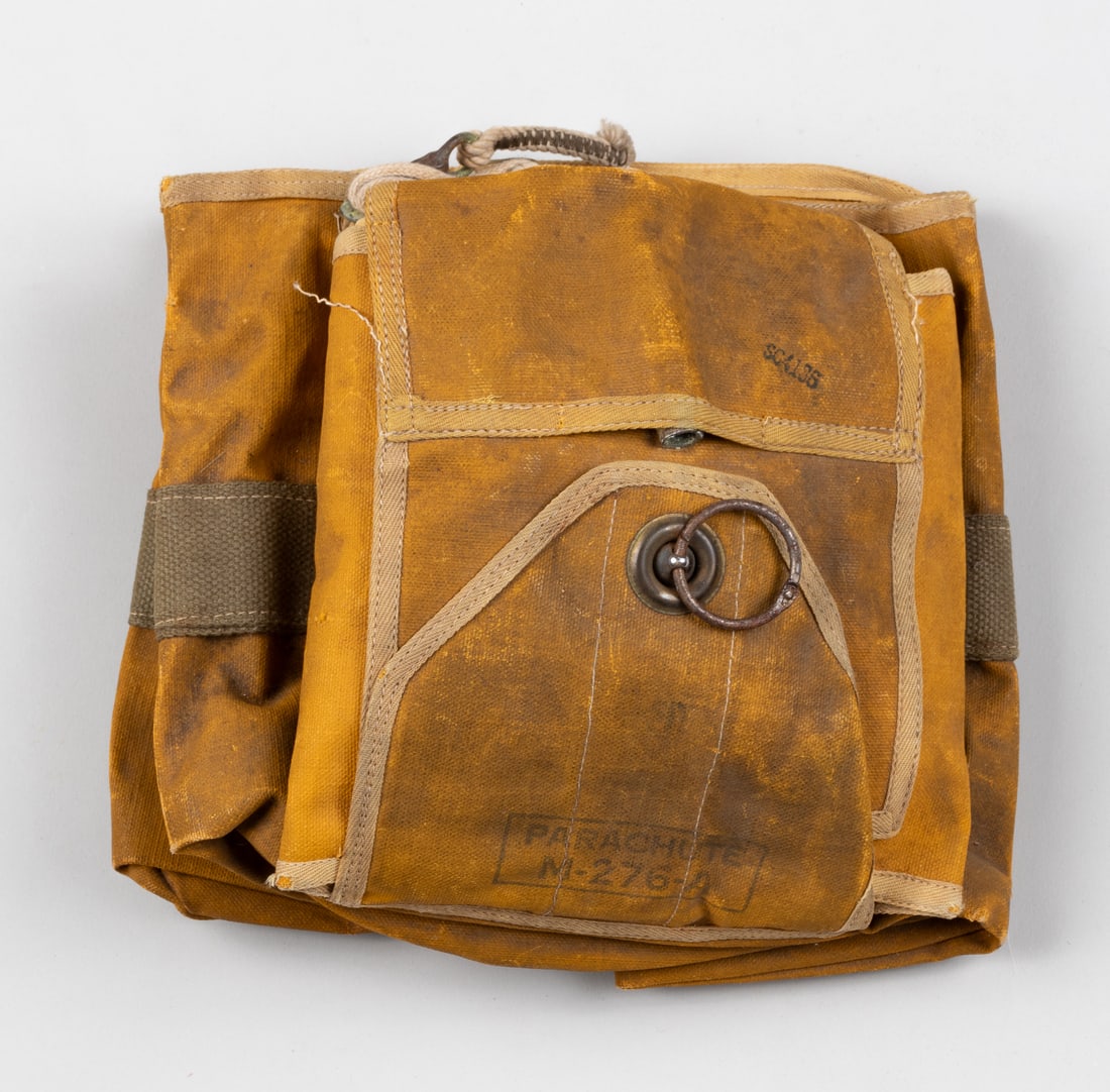 WWII US EMERGENCY PARACHUTE: World War II U.S. Forces emergency parachute, type M-276-A. In unpacked form. Smaller parachute which would have been deployed in emergency circumstances during the jump. Approximately 10 x 9 x 4 inch