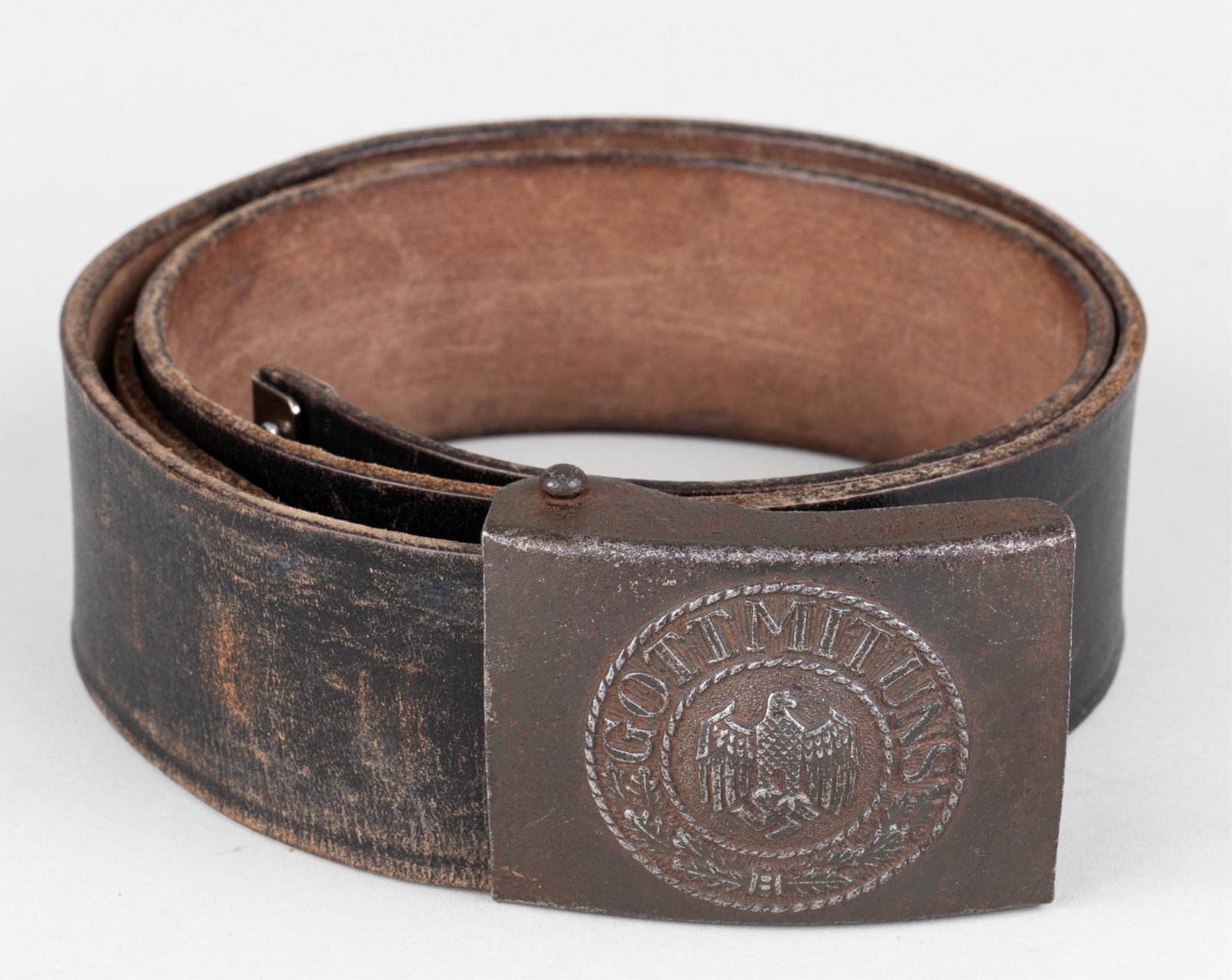 WWII GERMAN HEER BELT WITH BUCKLE: German WWII Heer belt and belt buckle, the front of the buckle reads 'Gott Mit Uns' with relief of Nazi eagle and swastika, on the reverse is the makers mark for Assman and stamped 'A.S.' Includes bla