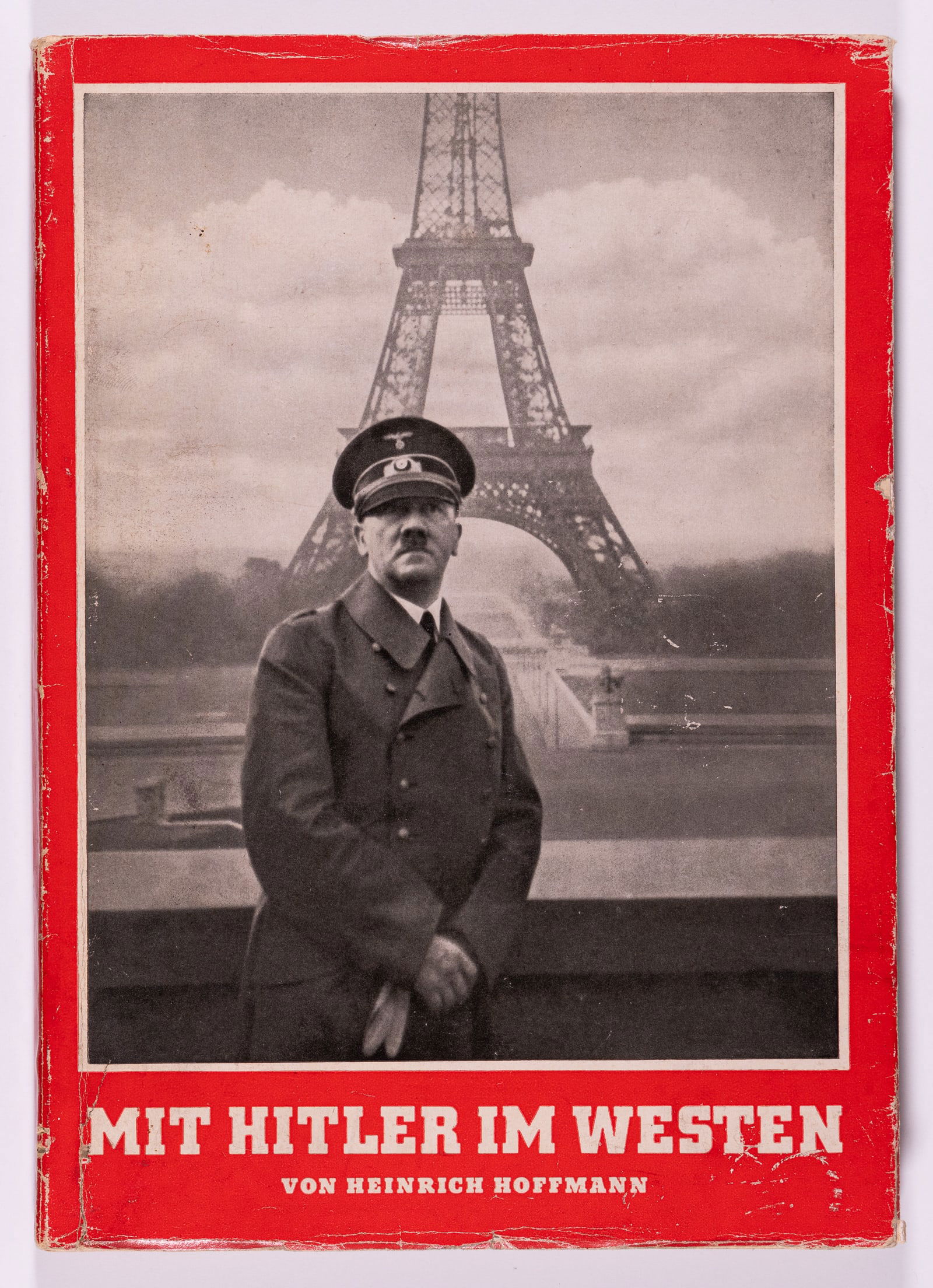 WITH HITLER IN THE WEST - MIT HITLER IM WESTEN: 'With Hitler in the West' WWII German photo book by Heinrich Hoffman, 1940. Soft cover book with original dust jacket, minor chips, 190 b/w photos, including the famous photo of Hitler in front of the