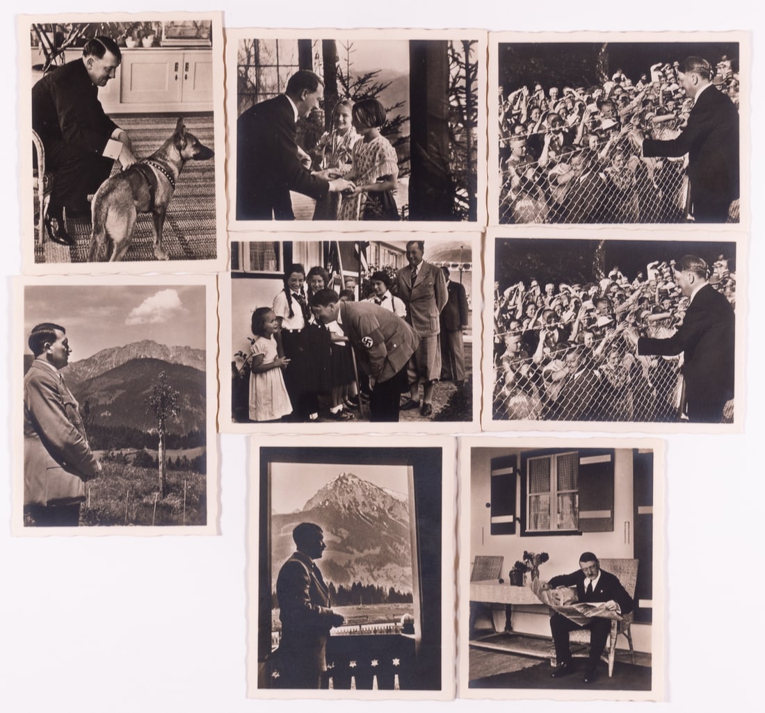 ADOLF HITLER PHOTOGRAPHS BY HEINRICH HOFFMANN: Set of eight original photographs of Adolf Hitler in his environment at the Berghof published by Heinrich Hoffmann, Hitler's designated personal photographer. Photographs bear printed caption on the b