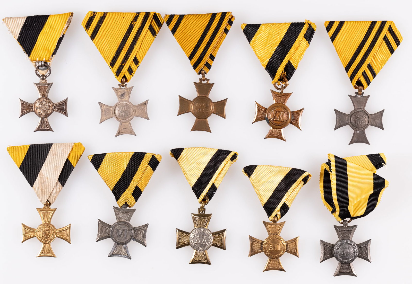 10 AUSTRO HUNGARY WWI MEDALS: Lot of ten Austro Hungary WWI medals, including three 12-Year Long Service crosses in bronze, silver, and gold, the 20-Year Long Service cross 1st Class, the 6-Year Long Service cross in silver, two 1
