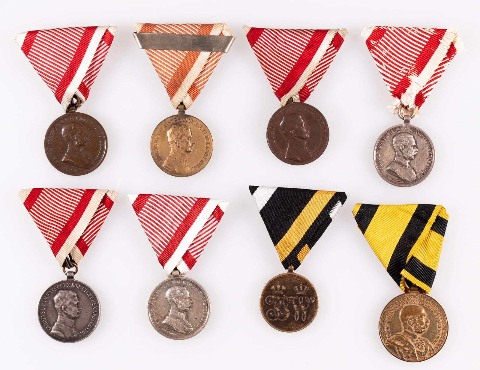 8 WWI AUSTRIA HUNGARY SERVICE MEDALS: Lot of eight WWI Austria-Hungary service medals, including three Medals for Fortitude in bronze, silver, and gold, three Medals for Bravery in bronze, and two in silver, the Denmark War Commemorative 