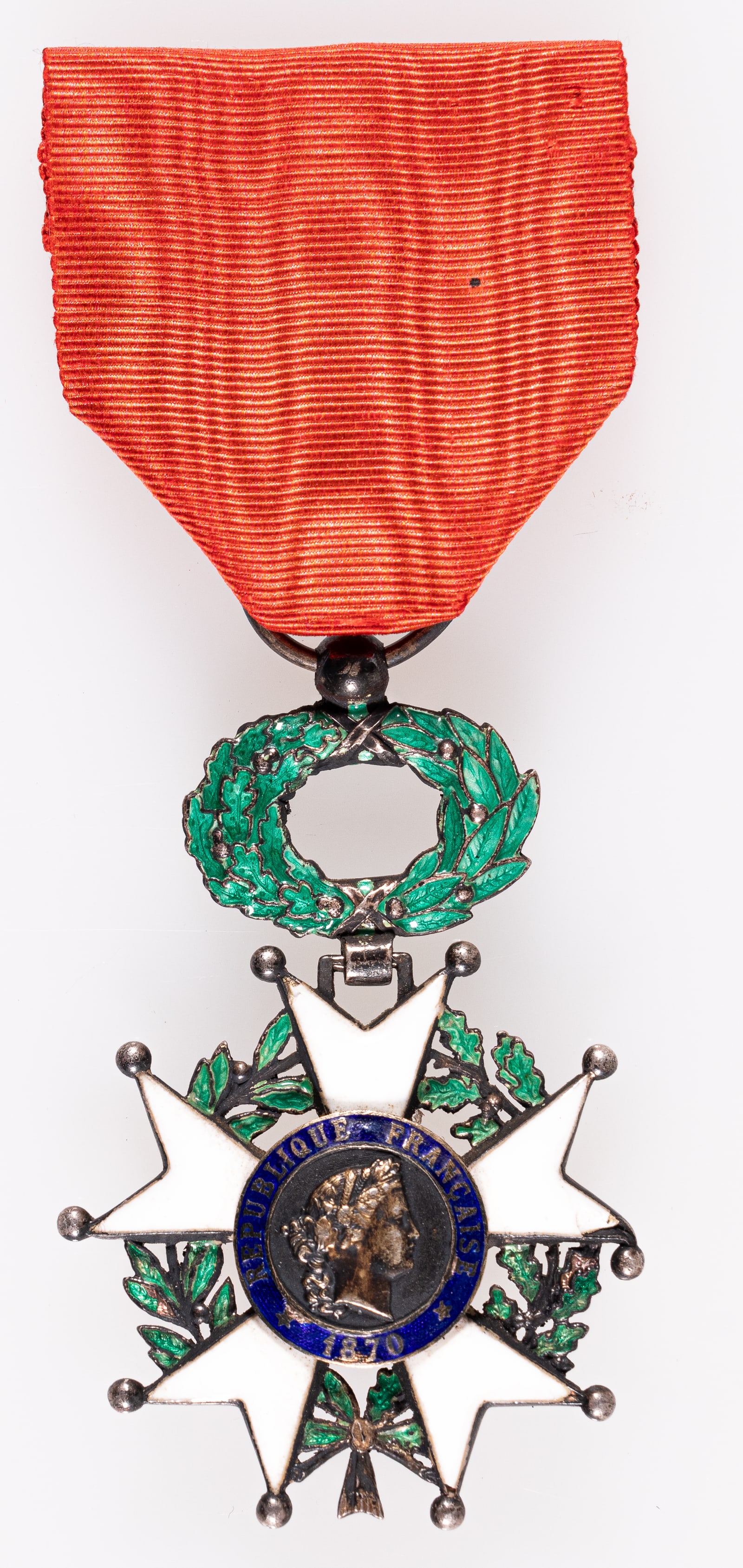 FRENCH LEGION OF HONOR MEDAL: French Legion of Honor medal, the front reads 'REPUBLIQUE FRANCAISE 1870' and the reverse reads 'HONNEUR ET PATRIE.' Some minor wear to the medal, and light cracking to some of the enamel. The Legion 