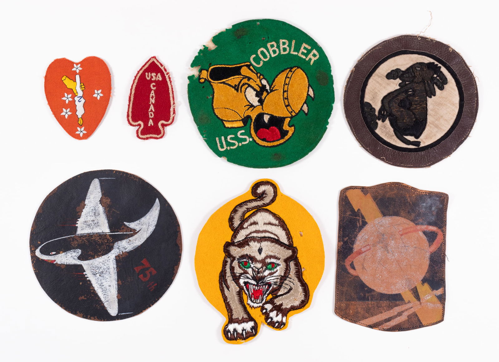WWII US SPECIAL FORCES PATCHES (7): Lot of four WWII US Special Forces patches, including the USA-Canada First Special Service Force patch, the Naval Attack Squadron Atkron-65 patch, the 75th Fighter Squadron Tiger Sharks patch, a USS G