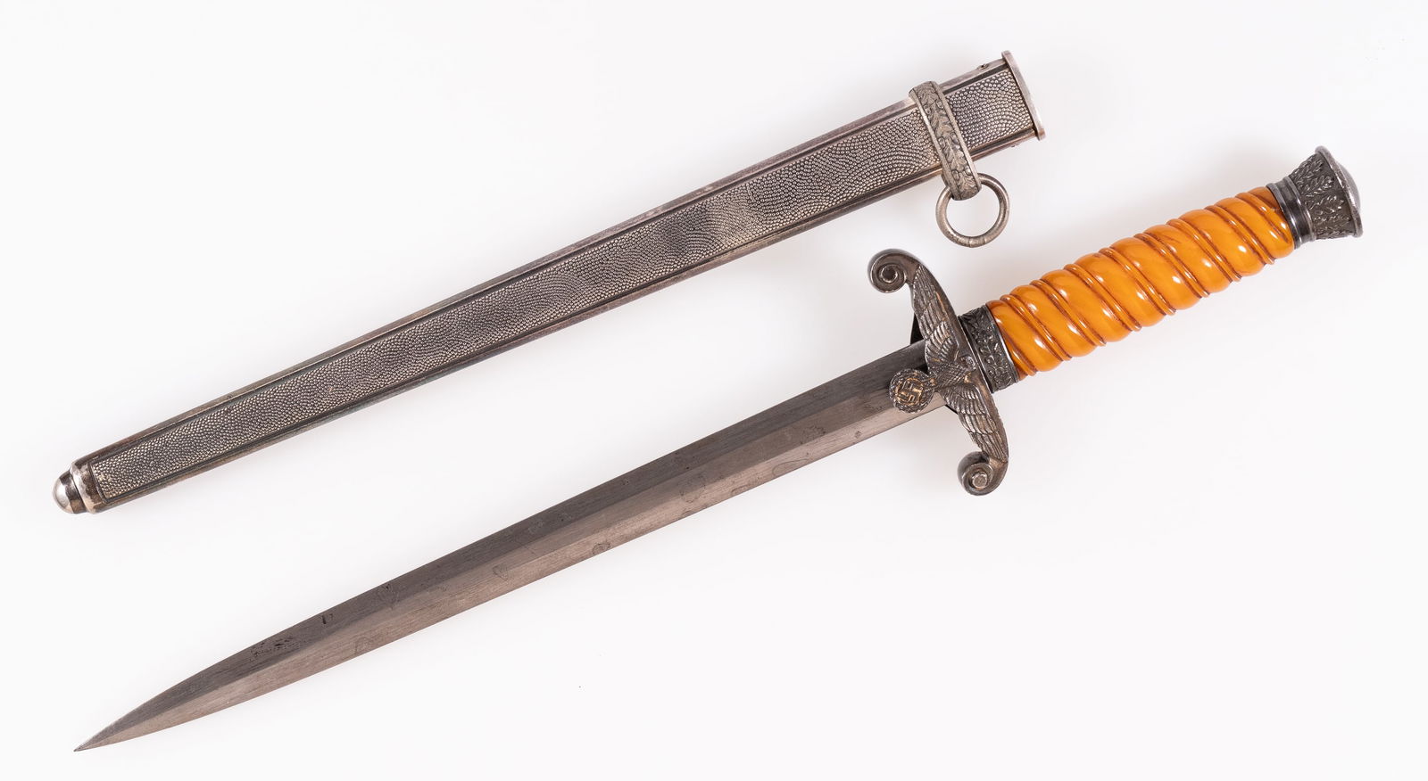 GERMAN WWII ARMY DRESS DAGGER BY CARL EICKHORN: German WWII officer's dress dagger type 1 made by Carl Eickhorn, Solingen. The scabbard has two side screws and the lower hanger band missing (could it be a WKC scabbard?). The blade is marked with th