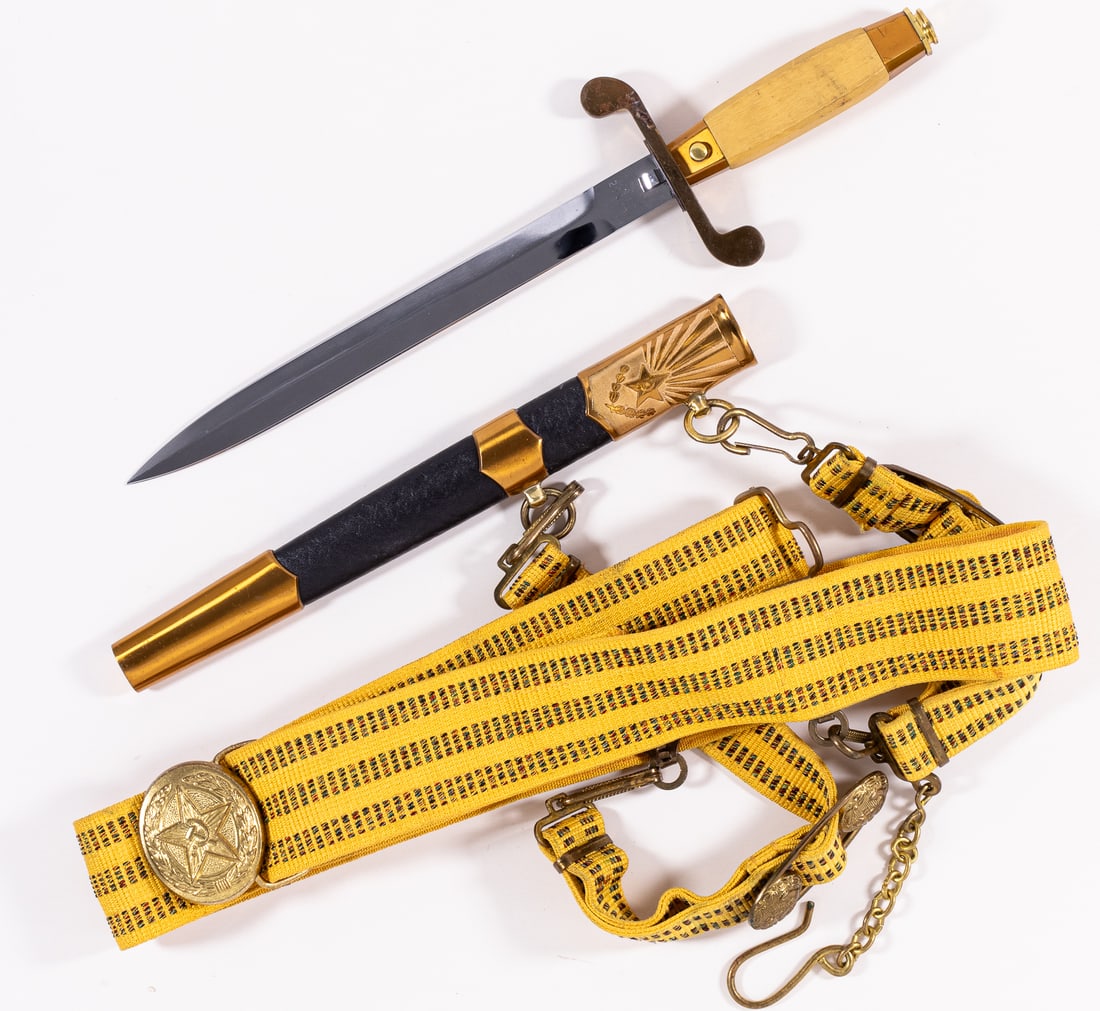 SOVIET ARMY OFFICER DRESS DAGGER & BELT W/ HANGERS: Soviet Army Officer's dress dagger with scabbard, dress belt, and hangers (naval buckles). The blade is dated 1992 and bears a serial number, A leather buffer pad is present, the pommel is marked with