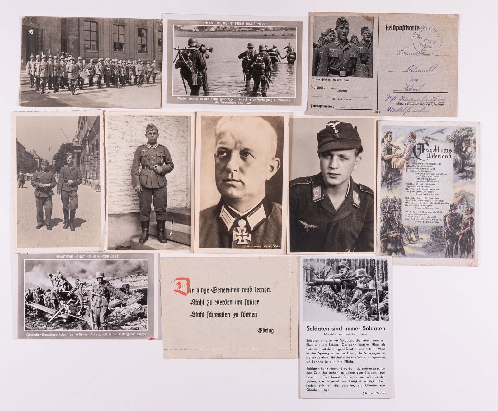 11 GERMAN WWII WEHRMACHT POSTCARDS & SOLDIER PHOTOS: 11 photo postcards of soldiers, infantry, song postcards, a Feldpost letter with a quote by Hermann Goering, a Heinrich Hoffmann real photo postcard of Knight's Cross recipient Generalmajor Walter Gor