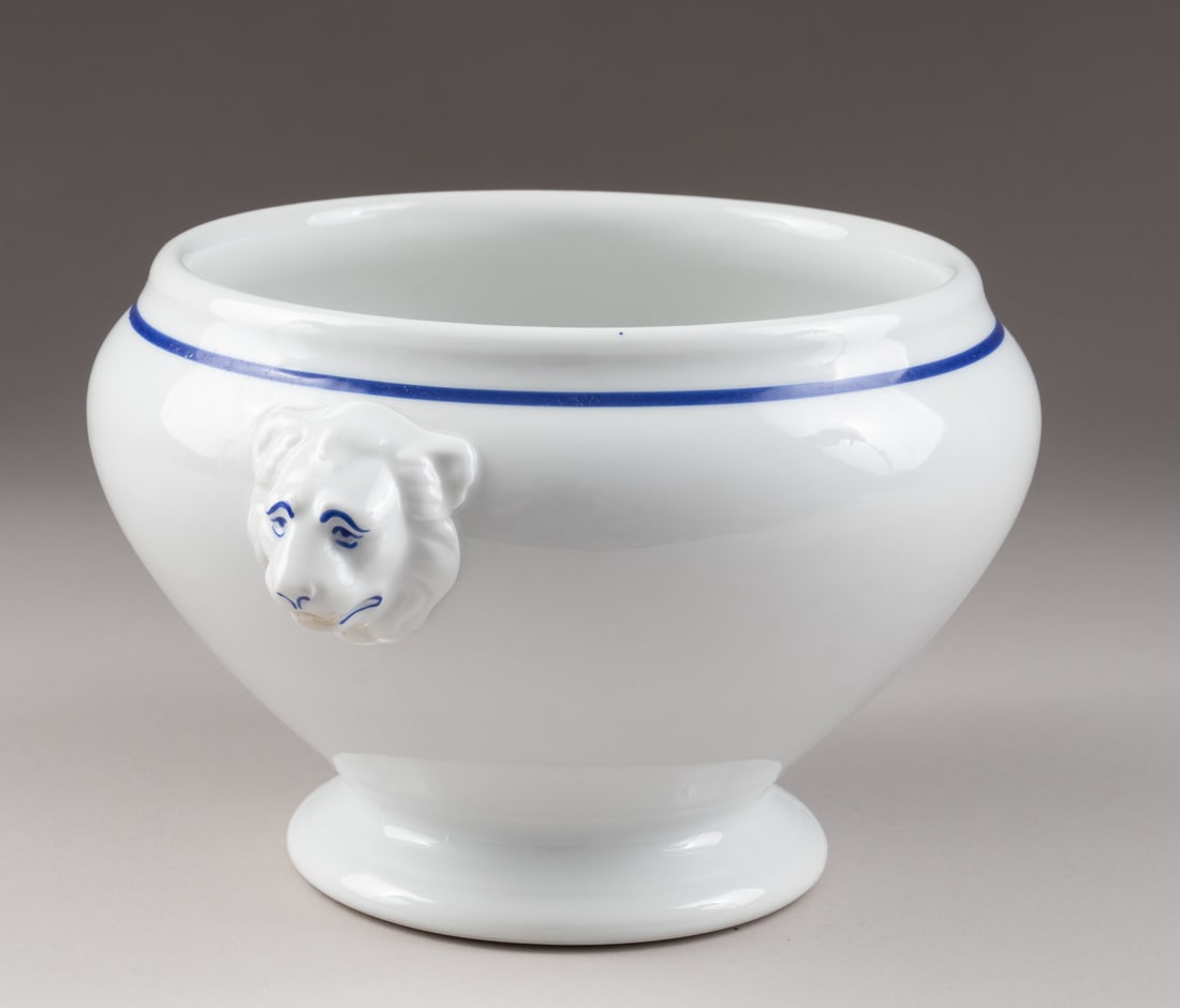WWII GERMAN WEHRMACHT SOUP BOWL: WWIII German Army porcelain soup bowl, stamped on the bottom 'H & Co Selb Bavaria Heinrich & Co 1938,' with a German Heer eagle insignia above it. White porcelain with blue accents, two lion heads on 