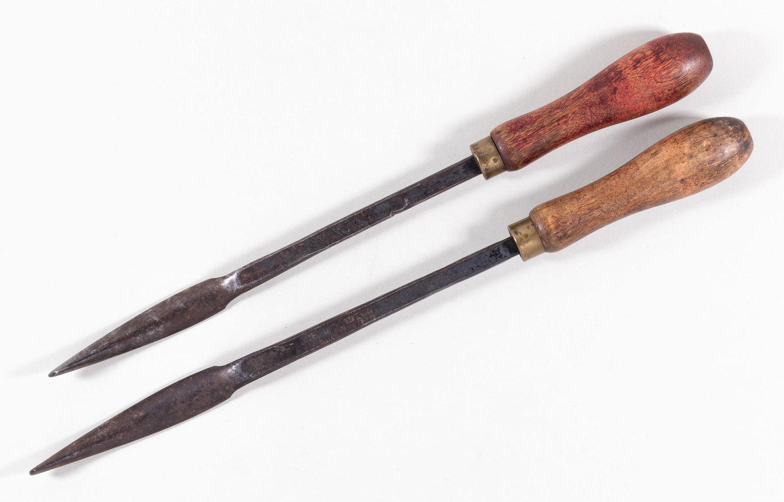 EARLY 1900S AMERICAN SWASTIKA TOOLS: Early 1900s American bearing scraper, from the Buffum Tool Company. On the back head of each scrapper is a swastika, on the rod is stamped 'Buffum Tool Co. Louisiana MO.,' each with a wooden handle. O