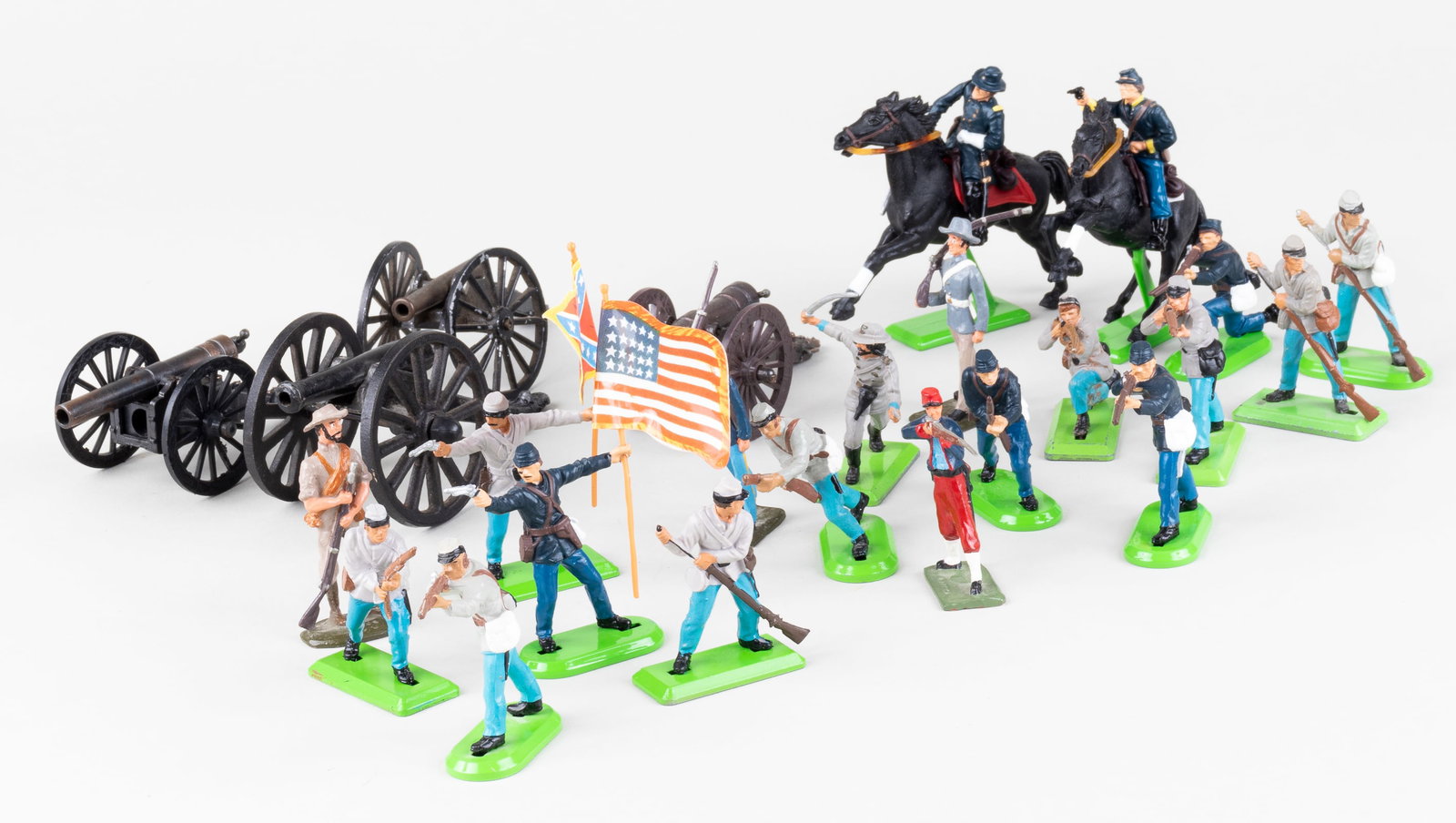 BRITAINS LTD TOY SOLDIERS CIVIL WAR SERIES: Lot of twenty vintage Britain's Ltd toy soldiers from the Civil War series, including eight Union soldiers, two riding horses, twelve Confederate soldiers, and four field artillery cannons, hand-paint