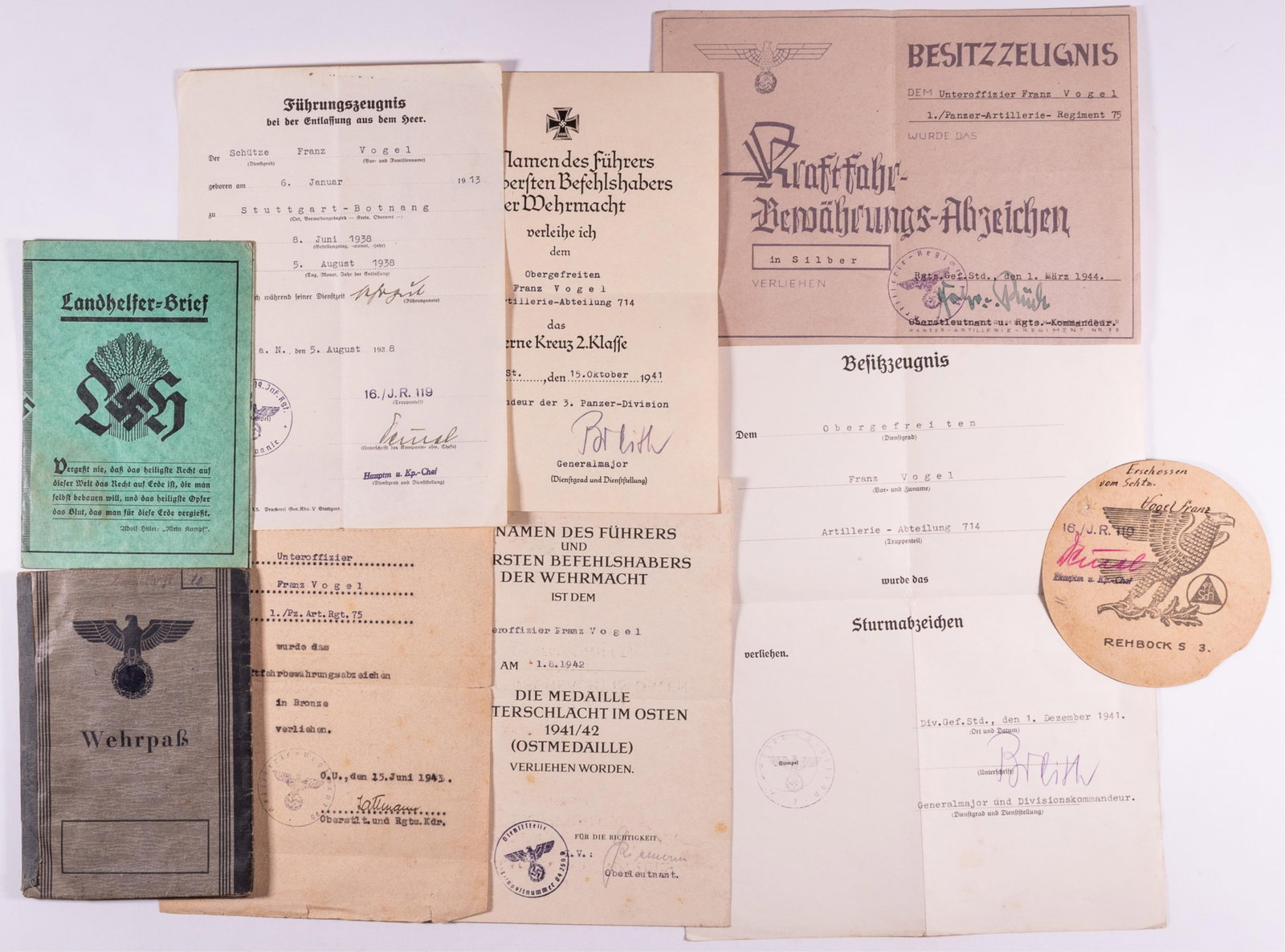 WWII WEHRPASS W/ AWARDS [GENERAL HERMANN BREITH]: WWII German Wehrpass with award documents for Unteroffizier Franz Vogel, born January 6 1913, Vogel served five months of service in 1938, followed by service from 1939 to 1945, close to the end of th