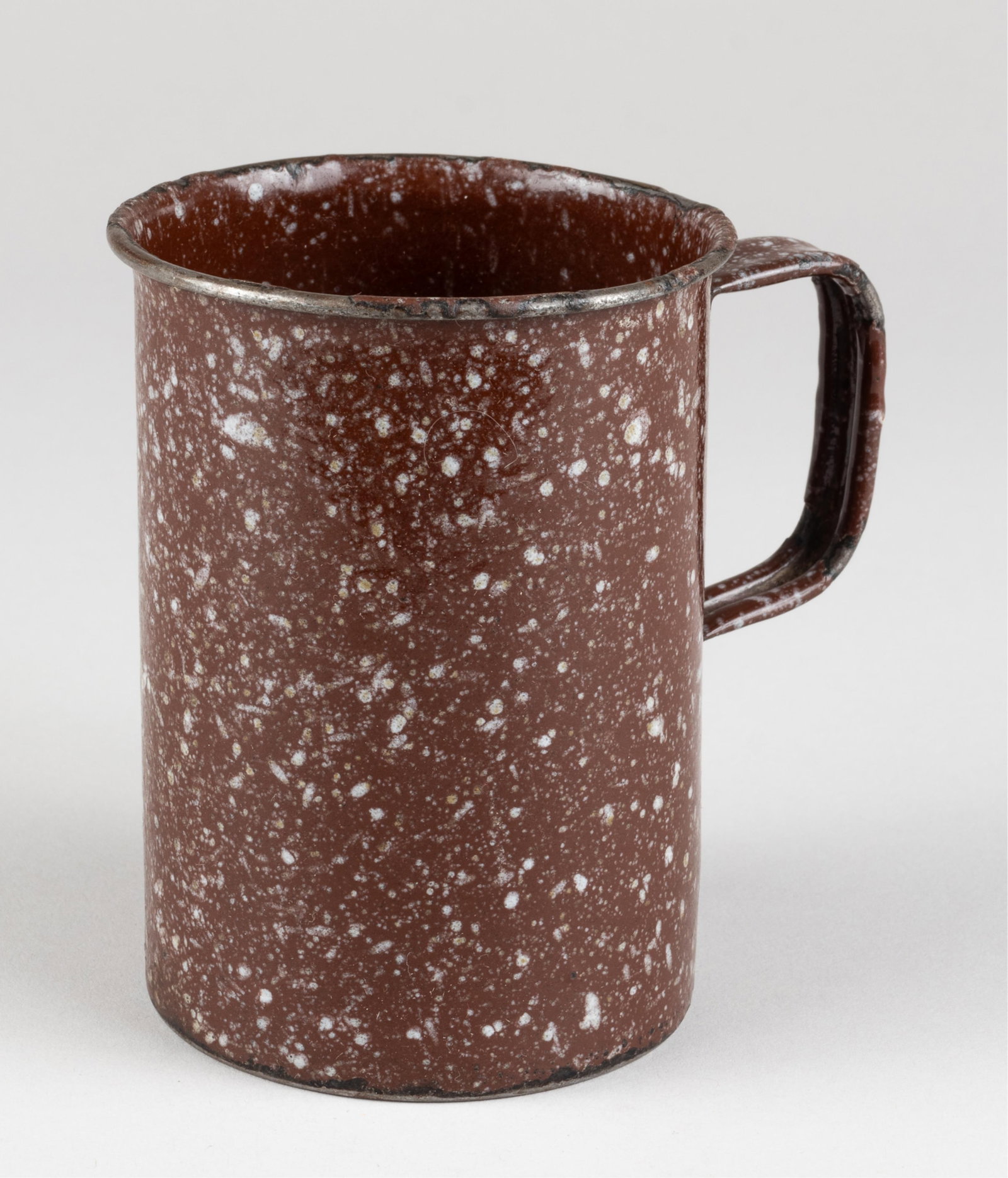 OSKAR SCHINDLER ENAMELED CUP: Enameled cup from the Oskar Schindler Emailwarenfabrik in Krakow, Poland. Schindler, through his factories and his now-famous list of 'workers,' saved the lives of 1,100 Jews. Workers in Oskar Schindl