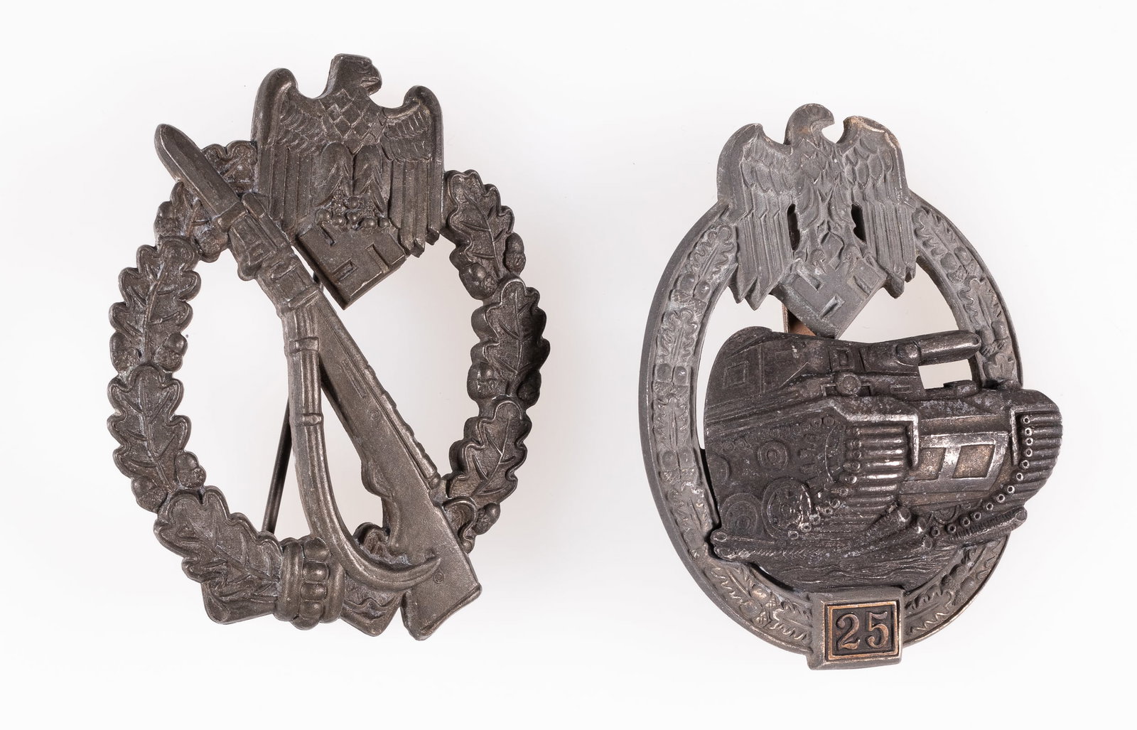 2 WWII GERMAN ASSAULT BADGES: Lot of two WWII German Assault badges, including the WWII German 25 Engagements Panzer Assault Badge, JFS pattern with no visible maker stamps, solid medal with C clasp pin back, Infantry Assault badg
