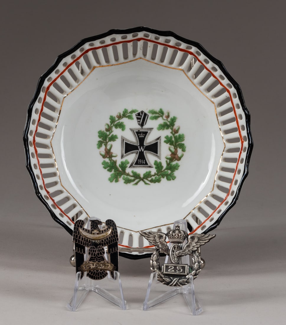 WWI GERMAN BADGES AND IRON CROSS VETERAN'S PORCELAIN DISH: Lot of two German badges with a 1914 Iron Cross Veteran's porcelain dish, 6.75 in. dia. WITH a 25 Years of Service Prussian railway workers silver badge, marked on the reverse John Wagner & Sohne 800 