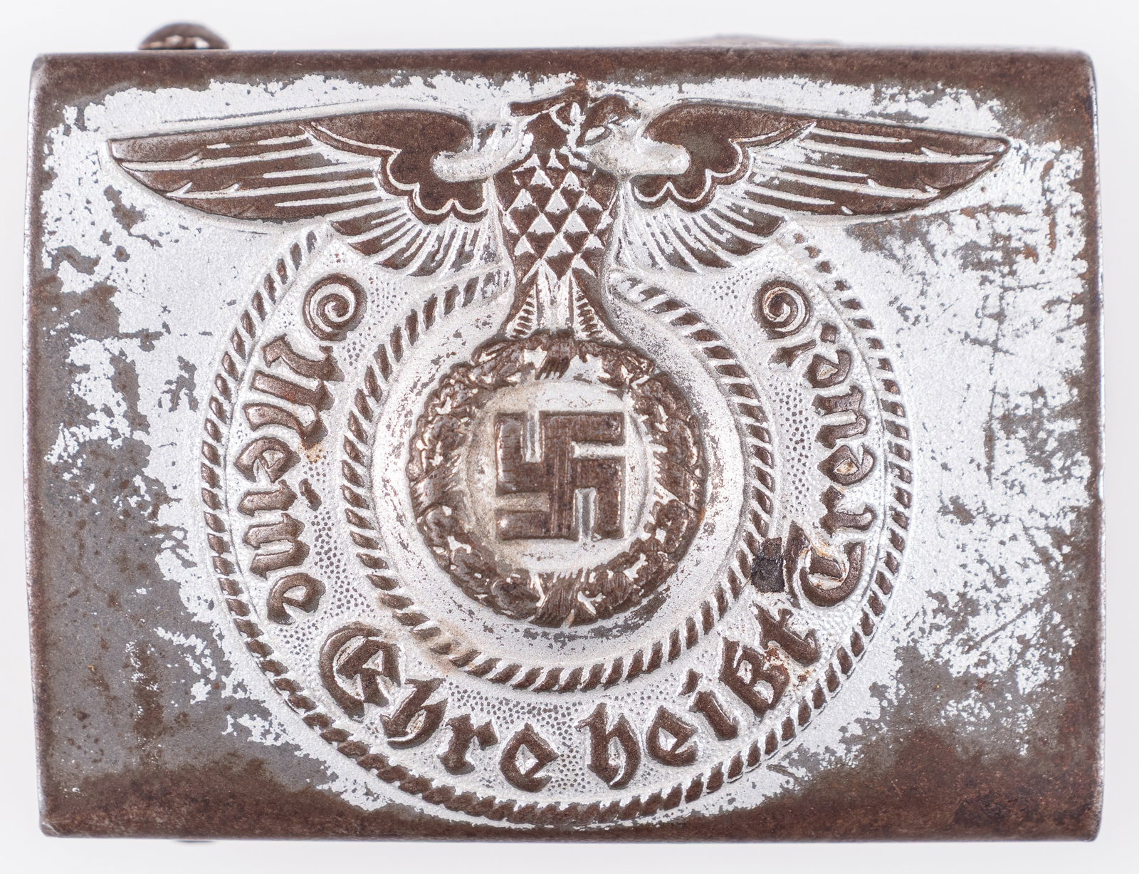 WAFFEN-SS BELT BUCKLE BY ASSMANN: Waffen-SS steel belt buckle by F.W. Assmann, Ludenscheid, marked underneath the prongs 'RZM 155/43 SS.' The front features the SS eagle clutching a wreath with a swastika in the center, with the sloga