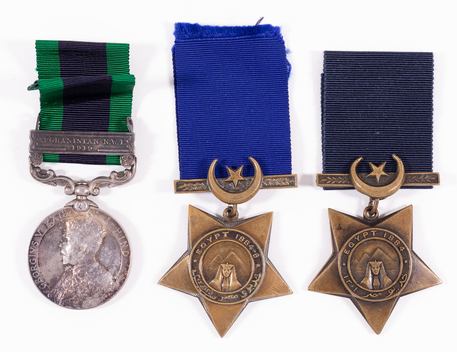 EGYPT KHEDIVE'S STAR AND INDIA GENERAL SERVICE MEDALS: Lot of three British Middle Eastern medals, including the India General Service Medal 1908-1935 (George V portrait) with the Afghanistan N.W.F. 1919 ribbon clasp, Awarded to and marked on the rim '799
