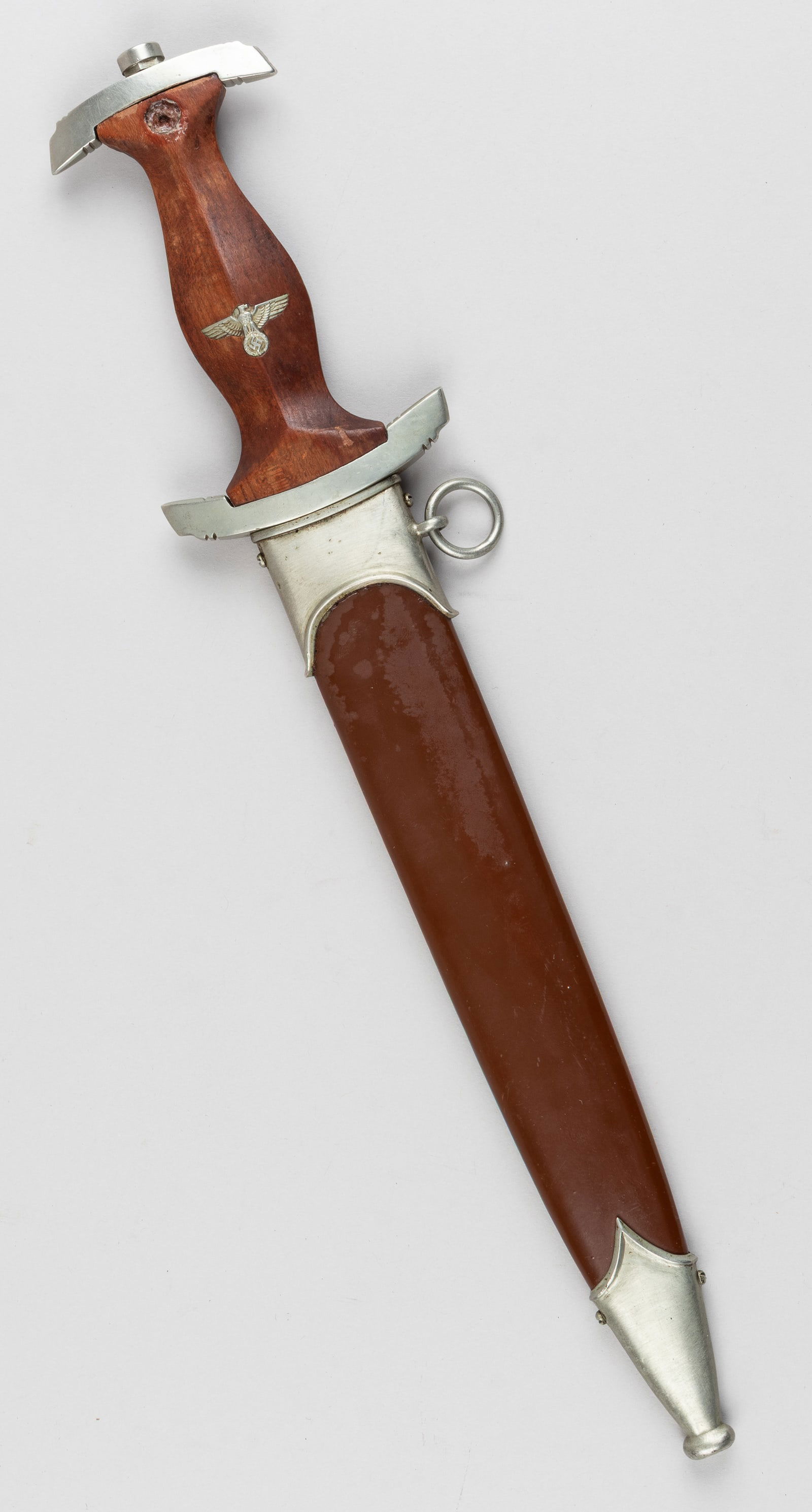 WWII GERMAN SA DAGGER BROHM: WWII German SA dagger with scabbard, wooden handgrip with inlaid with an SA party eagle, missing the SA insignia at the top, marked on the blade 'Alles fur Deutschland' filled with black paint. On the