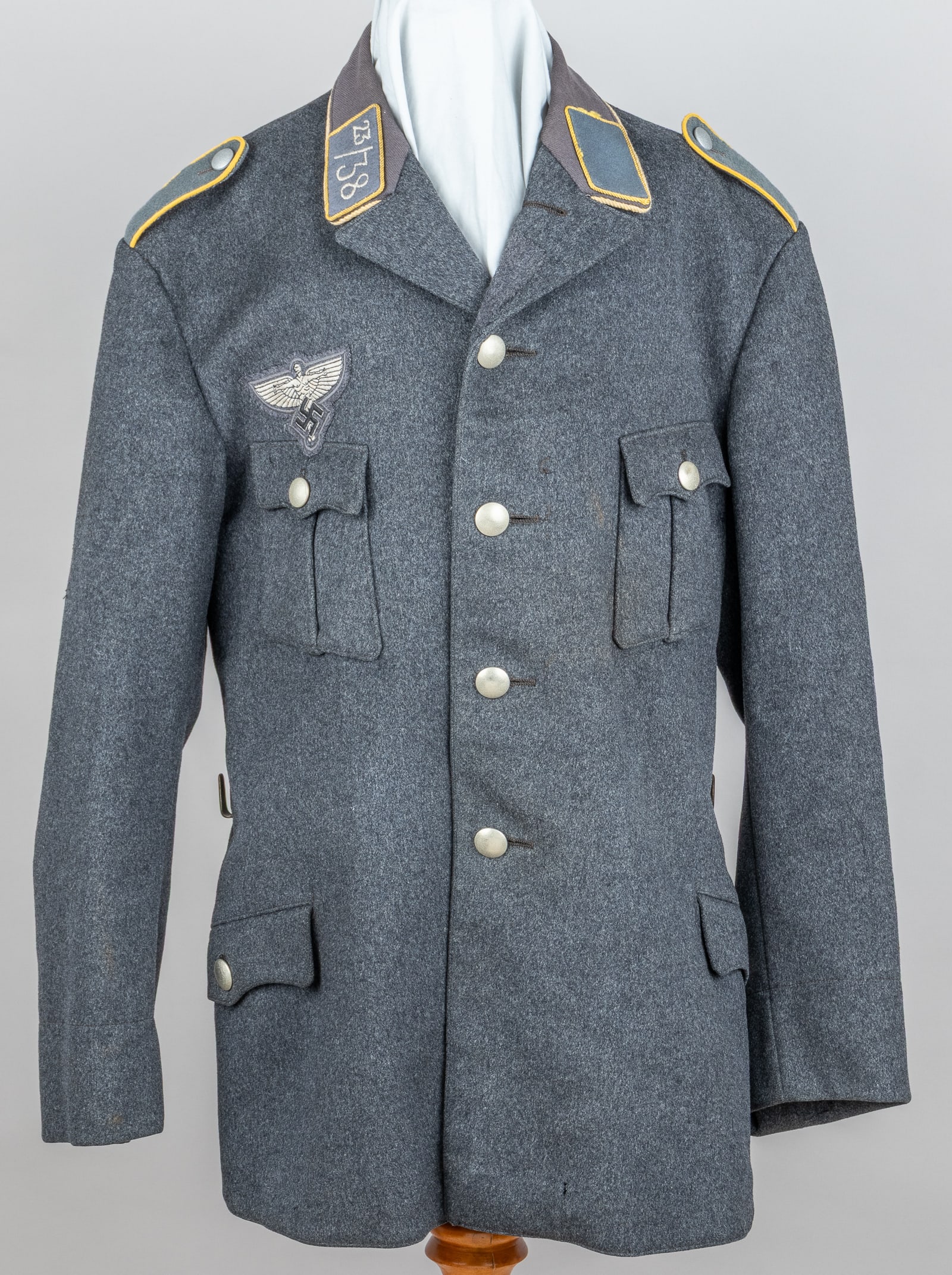 WWII GERMAN NSFK TUNIC: WWII German NSFK tunic, with the NSFK breast eagle above the right chest pocket, NSFK collar tabs, one has '23/38' stitched into the center for the unit, and NSFK shoulder boards. Both sides of the tu