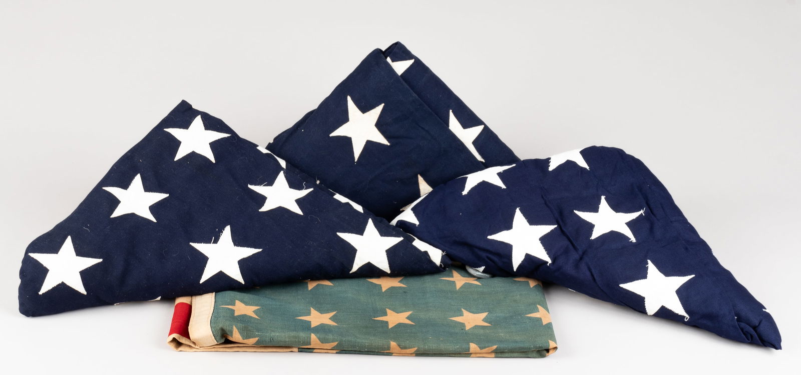 4 WWII AMERICAN FUNERAL FLAGS: Lot of four American Service flags, including one 48-star American Stars and Stripes flag, and three 51-star flags, wear and stains, 75 x 42 inches. 4 pieces.