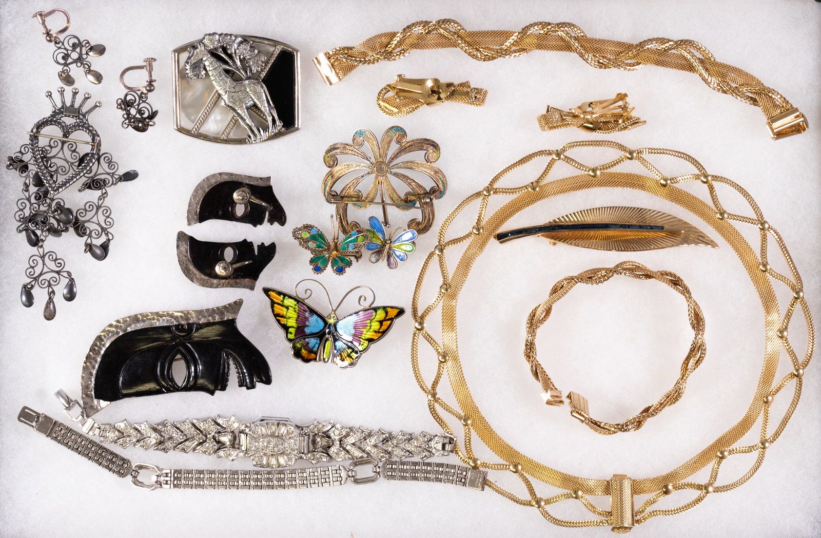 VINTAGE JEWELRY (18 PIECES): Lot of eighteen pieces of vintage jewelry, including a necklace, two barrettes, and two bracelets marked 'Crosse 1954,' gold color broach marked 'Boucher 6954,' two mask earrings and broach marked 'st