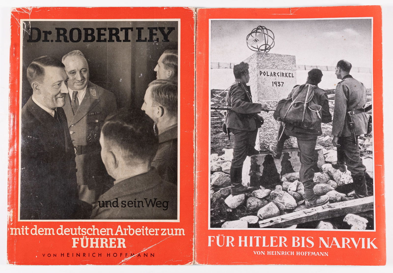 HITLER PHOTO BOOKS BY HEINRICH HOFFMANN (2): Lot of two Hitler photo books by Heinrich Hoffman, each with the original dustcover, including 'Dr. Robert Ley and His Journey With the German Worker to Become the Leader,' tearing and chipping to cov