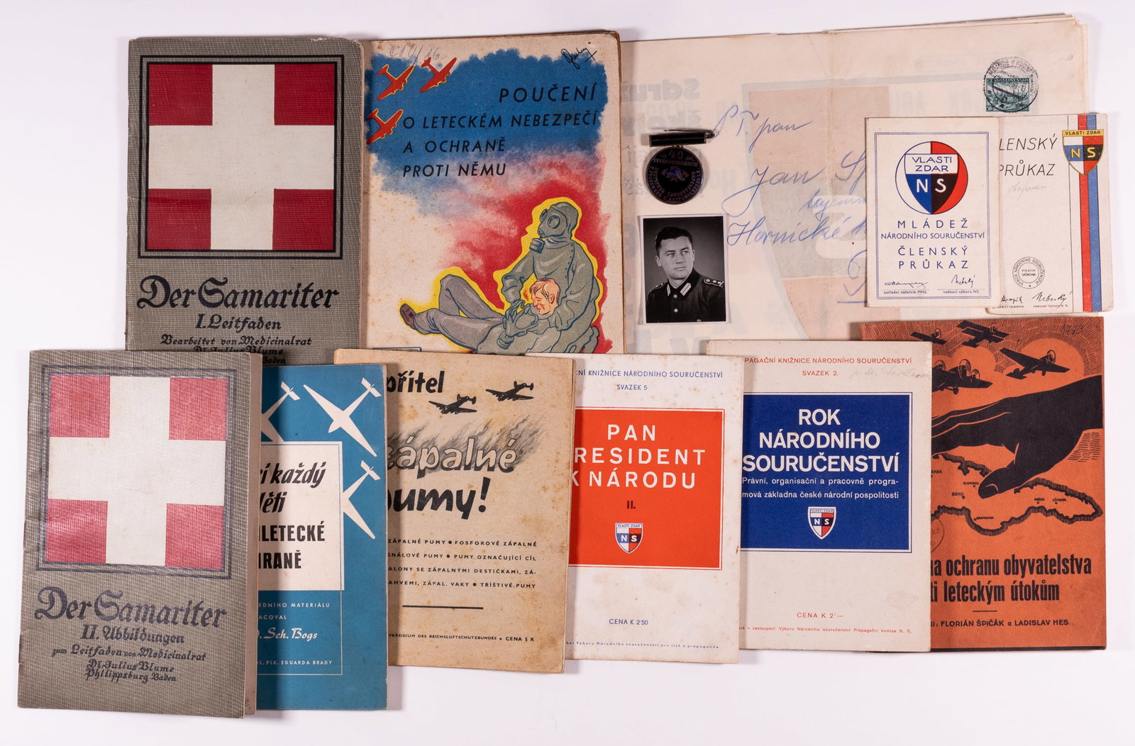 WWII CZECH NATIONAL PARTNERSHIP PARTY EPHEMERA: WWII Czech pro-Third Reich National Partnership party ephemera, including Volumes 2 and 5 of the Promotional Library of the National Partnership, a poster promoting a concert being held by the party. 