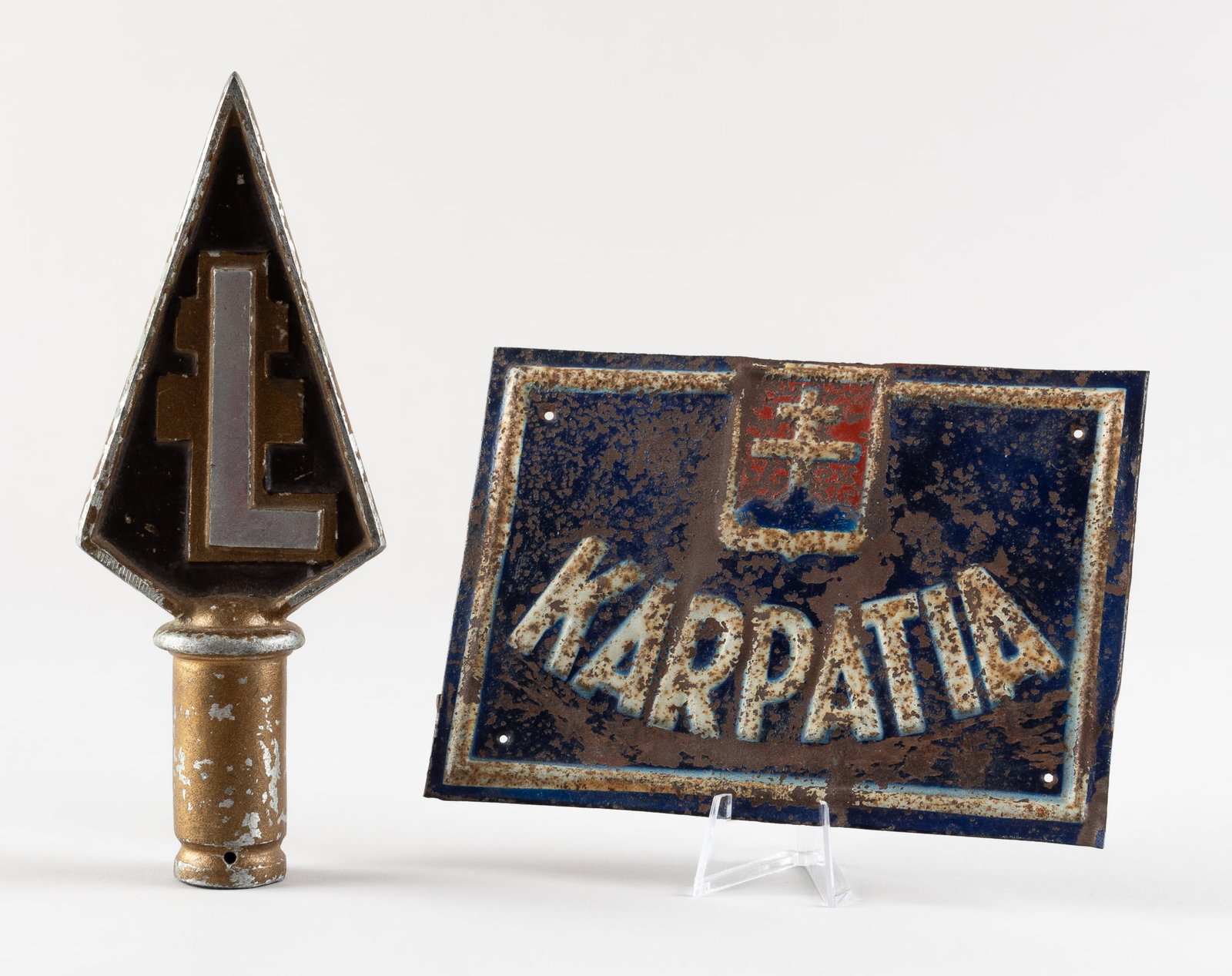 HUNGARIAN LEVENTE YOUTH FLAG POLE TOPPER: Hungarian Levente youth organization flag pole topper, appears to be nickel construction topper with brass and brown colored paint. Paint chipping in places and showing oxidation in places. 8 inches t