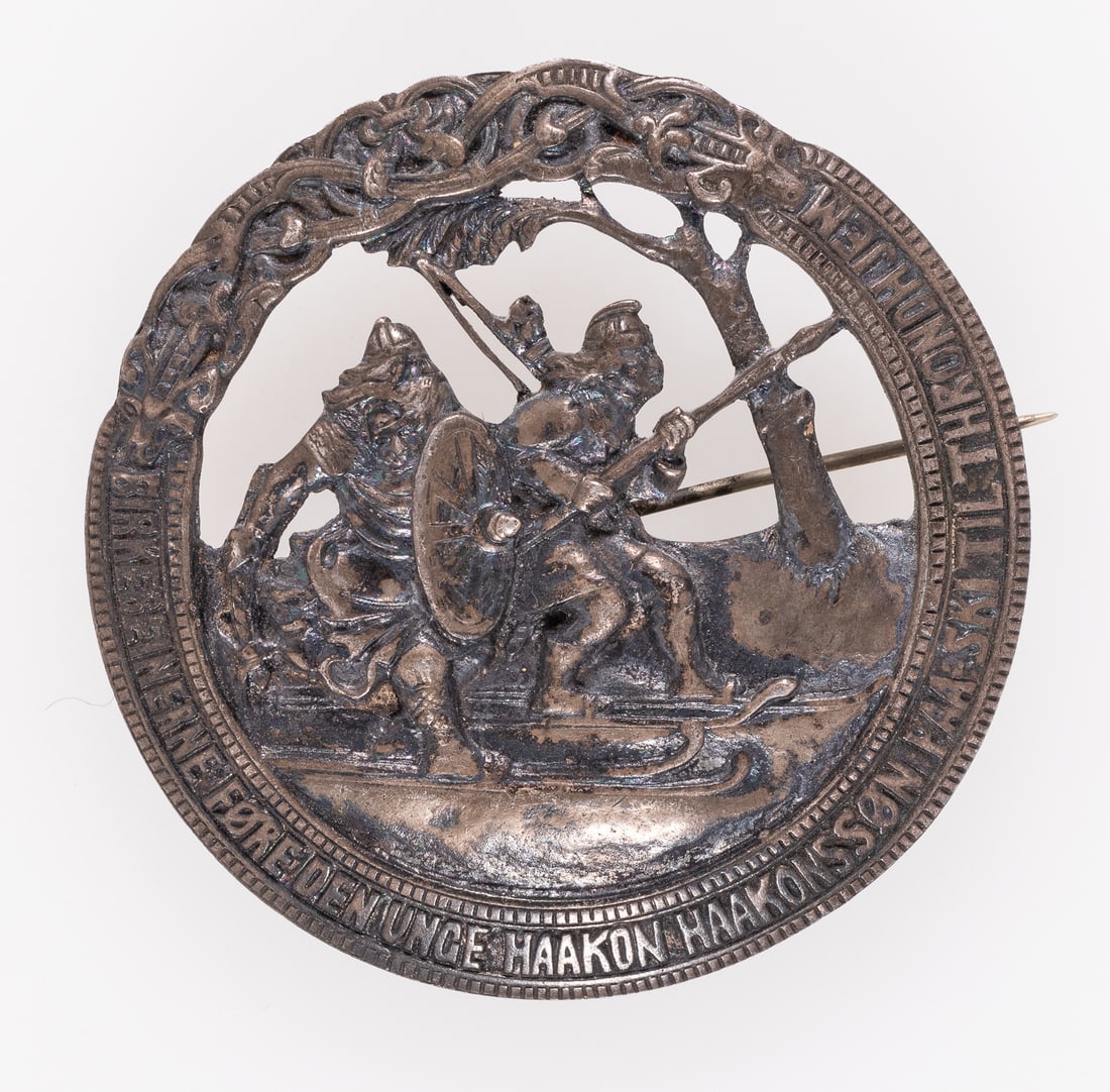 1900S BIRKENBEINER WARRIORS NORWAY 830 SILVER BROOCH: 1900s Birkenbeiner Warriors Norwegian silver brooch, the scene features the two Birkenbeiner Warriors with birch tree bark ski shoes saving young Haakon Haakonsson. Designed after the 1869 painting 'B