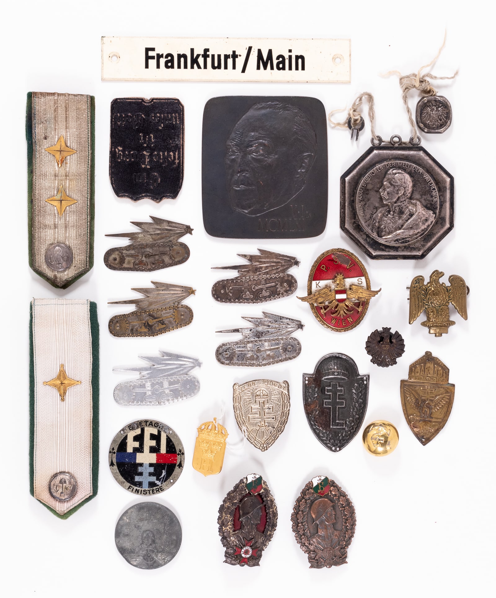 20 EUROPEAN MILITARY MEDALS INSIGNIA AND BADGES: Twenty European medals, insignia, and badges, including two Bulgarian Badges of Honor of the Infantry, one in bronze and one in silver, a Hungarian 1942 Russian Front Christmas medal, three Hungarian 