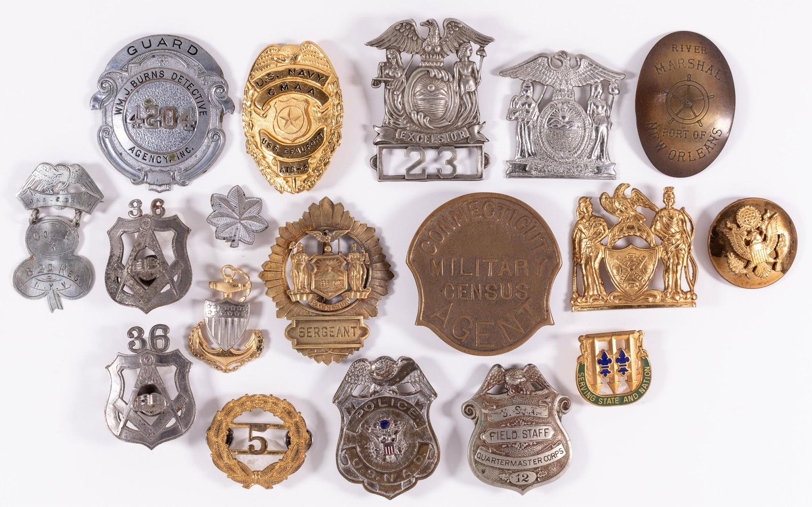 20 US MILITARY POLICE BADGES AND INSIGNIA: Twenty US Military Police badges and insignia, including a WM. J. Burns Detective Agency badge, USNAD Police badge, Connecticut Military Census Agent badge, Excelsior Sergeant badge, Navy CMAA badge, 