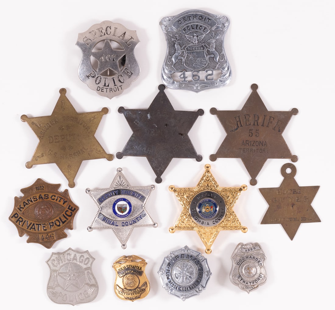 13 OBSOLETE AMERICAN POLICE BADGES: Thirteen obsolete American police badges, including two Arizona Territory US Marshal Deputy badges, a Pinal County Deputy Sheriff badge, a Detroit Special Police badge, a Detroit Police badge, a Chica
