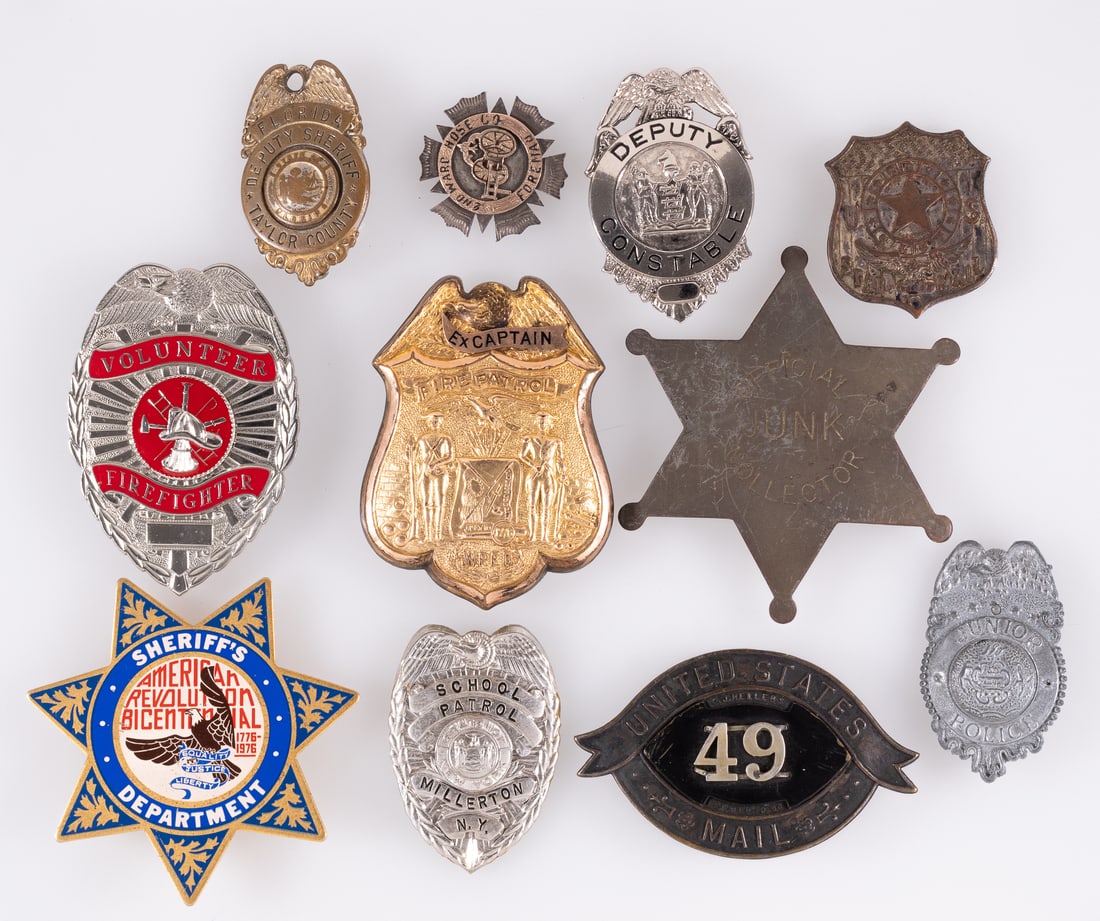 11 OBSOLETE US SERVICES BADGES: Eleven obsolete US police badges, including the American Revolution Bicentennial Sheriffs Department badge, a Fire Patrol Ex Capitain badge, Volunteer Firefighter badge, Deputy Constable badge, United